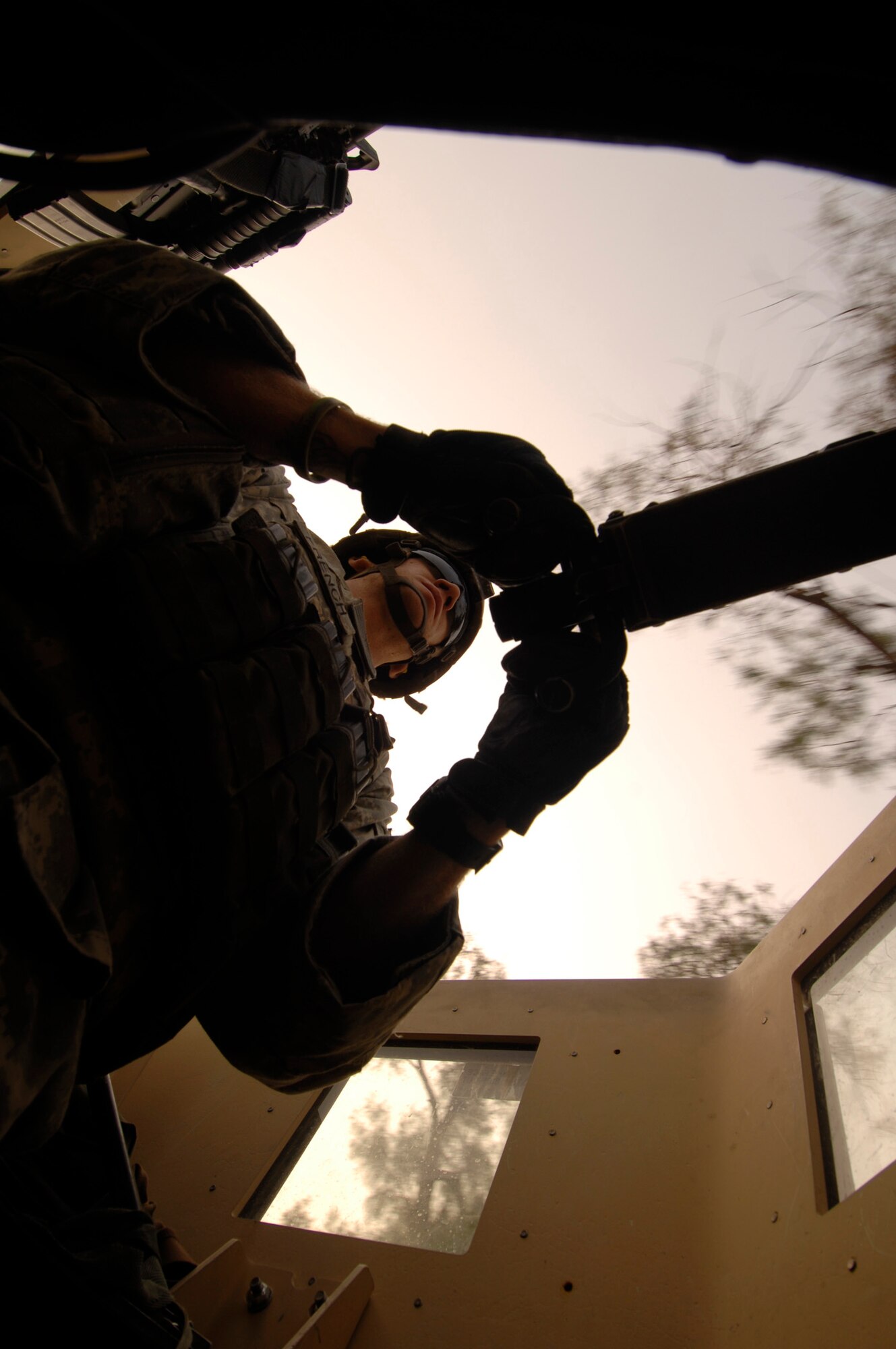NANGARHAR PROVINCE, Afghanistan – An Army gunner in the turret of a High Mobility Multipurpose Wheeled Vehicle, keeps a careful eye on traffic while on a canal assessment mission with the Nangarhar Provincial Reconstruction Team, Nov. 10, 2007.  

The Nangarhar PRT is a joint team of Airman, Soldiers, and representatives from the U.S. Department of State, the U.S. Agency for International Development and the U.S. Department of Agriculture.  The team is responsible for helping the Government of the Islamic Republic of Afghanistan improve security, governance and promote reconstruction in Nangarhar Province.  The PRT assesses community needs and then builds schools, government centers, roads, medical capability and basic infrastructure throughout Nangarhar Province.  (U.S. Air Force photo by Staff Sgt. Joshua T Jasper)

