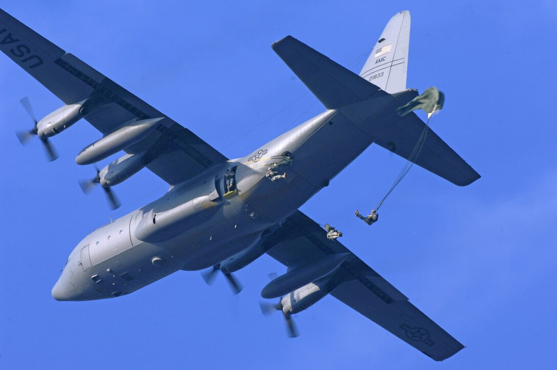 U.S. Army paratroopers from the 82nd Airborne Division parachute from a C-130 Hercules aircraft over Ft. Bragg, N.C., Dec. 8, 2007, during Operation Toy Drop. The 10th Annual Randy Oler memorial Operation Toy Drop is hosted by the U.S. Army Civil Affairs and Psychological Operations Command (Airborne) and is a foreign wings exchange and community service operation to support the military and local community by collecting over 1,400 toys for deserving families in the Fayetteville area.