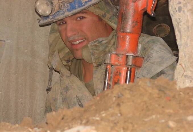 Hospital Corpsman 2nd Class Chris Dare, technical rescue technician with Chemical Biological Incident Response Force, II Marine Expeditionary Force, drills a hole through a concrete tunnel at the Raymond M. Downey Sr. Responder Training Facility. Dare is one of a few Sailors in CBIRF history qualified to be a technical rescue technician.