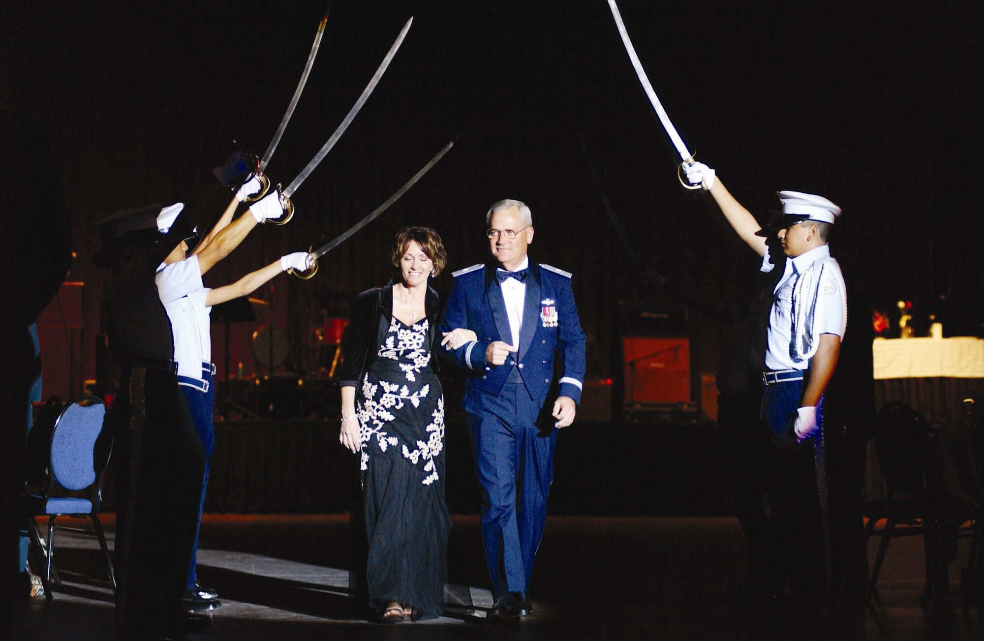 The 452nd Air Mobility Wing Commander and host of the ball, Brig. Gen. James Melin, escorts his wife Linda.(U.S. Air Force photos by Master Sgt. Keith Baxter/ 4th CTCS)