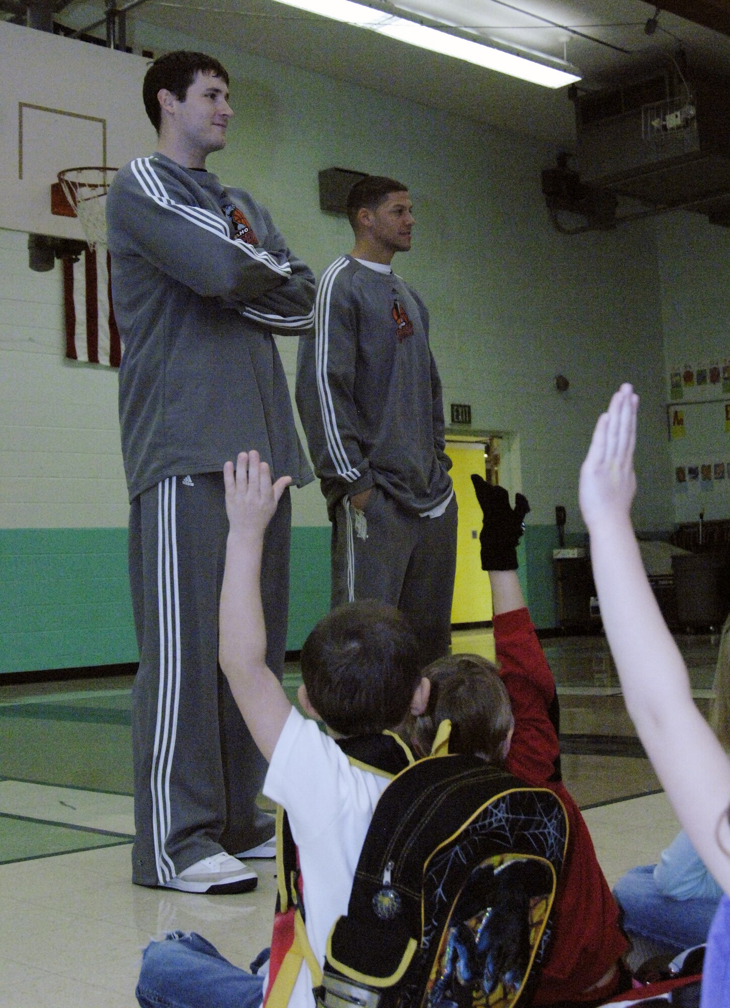 MOUNTAIN HOME AIR FORCE BASE, Idaho -- Cory Violette and Roberto Bergesen, members of the Idaho Stampede basketball team, speak with children at the base primary school Dec. 10. The Idaho Stampede is a member of the NBA D-league with its base of operations in Boise, Idaho. (U.S. Air Force photo/ Staff Sgt. Rodney D. Ivey)