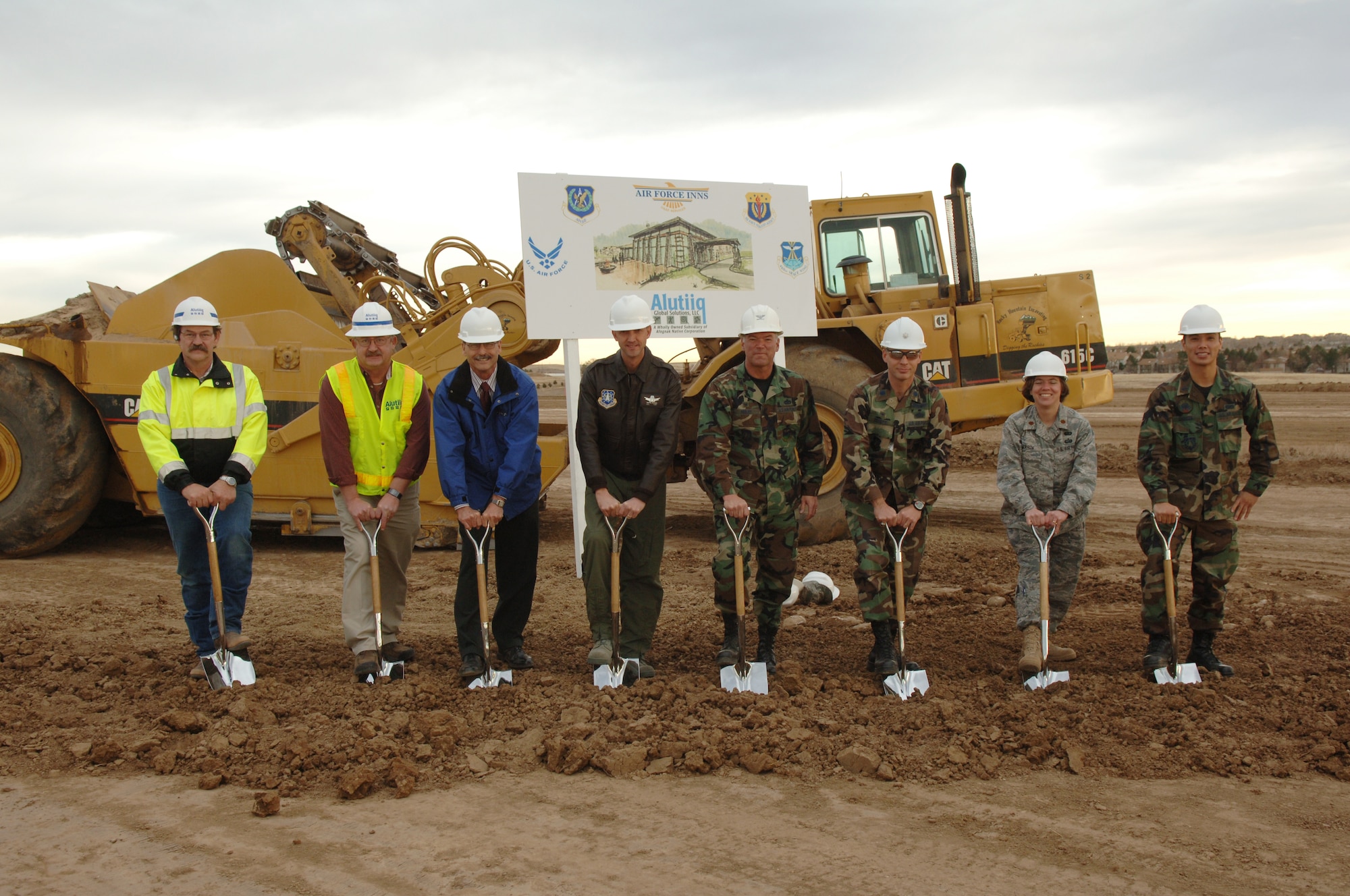 BUCKLEY AIR FORCE BASE, Colo. -- Col. Bart Hedley, 460th Mission Support Group commander, Lt. Col. James Zemotel, 460th Civil Engineer Squadron commander, Maj. Teresa Darrow, 460th Services director, 1st Lt. Lionel Lanuza, 460th Civil Engineer Squadron, Col. Wayne McGee, 460th Space Wing commander and Bob Zulick, Tim Roberts and Leonard Gallippo of Alutiiq contracting break ground at the site of the visiting quarters/temporary living facility during a ceremony here Dec. 3. The project is the second largest for Buckley in recent years. Housing being the largest. The project includes 120 visitor's quarters and 30 temporary living facility units. 

During the groundbreaking ceremony, Colonel McGee mentioned the fact that the project will support the base's mission and families during temporary duty and permanent change of station. He said the VQ/TLF will "bring our community into the future."

The VQ/TLF is scheduled for completion in March 2009. (U.S. Air Force photo by Airman 1st Class Christopher Bush)