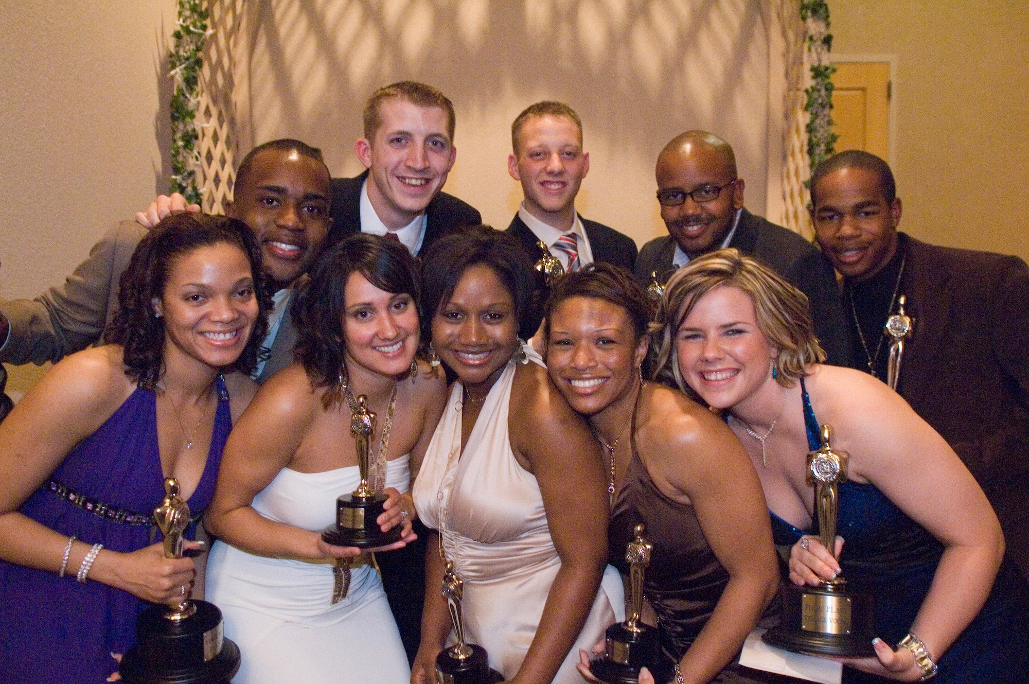 The winners of the Air Force Tops in Blue Worldwide Talent  competition was (left to right) Corey Sims, male vocalist; Brian Carmack, male vocalist; David Butler, specialty; Henry Roberson, instrumental bass; Chris Gadson, instrumental drums; Tyrona Pearsal, dance; Chandra Smith, female vocalist; Alice Lewis, female vocalist; Courtney Wallace, dance; and Ashley Montgomery, female vocalist. The banquet was at the collocated club on Lackland Air Force Base, Texas, Dec. 10.  (U.S. Air Force photo/Tech. Sgt. Cecilio Ricardo) 