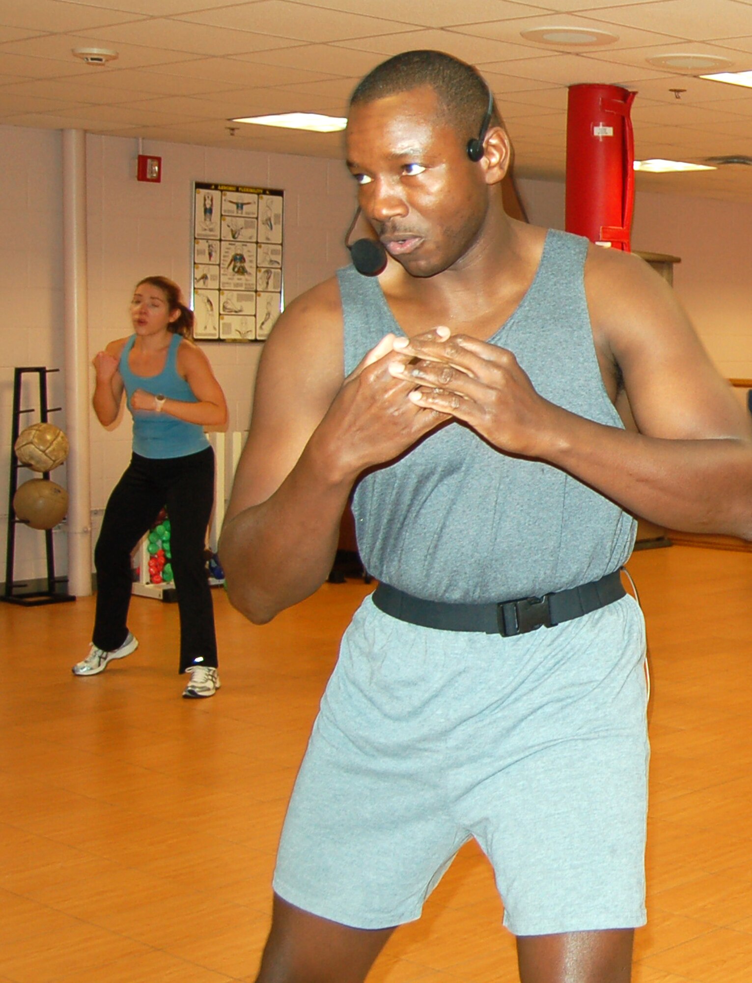Aerobics instructor Ron Godley leads a class Dec. 7 at the base fitness center. The center hosted a day-long Aerobic-a-thon that collected hundreds of toys for Toys for Tots. (Air Force photo)