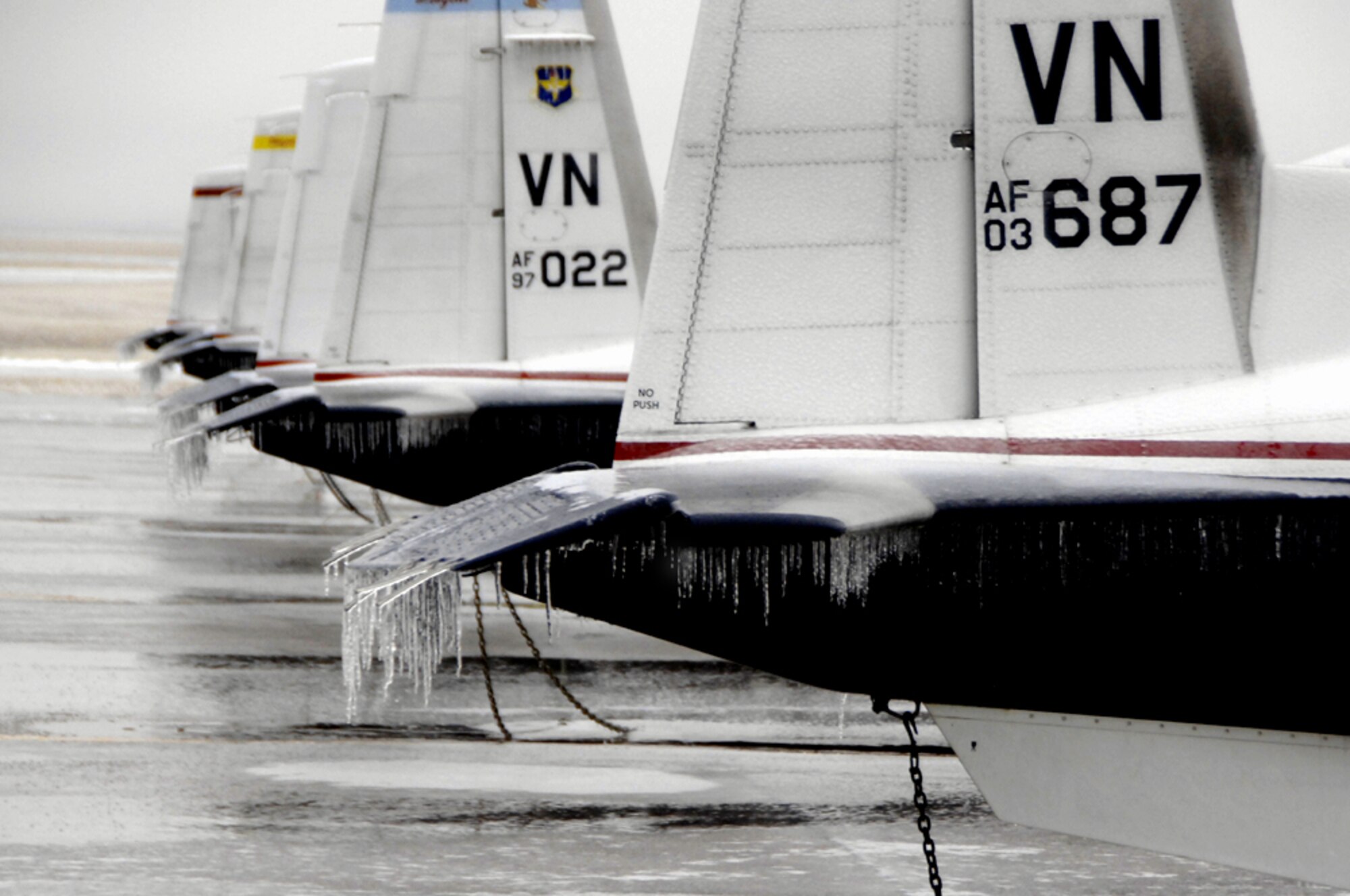 T-6A Texan IIs sport icicles on their static wicks and horizontal stabilizers. (U.S. Air Force photo by Terry Wasson)