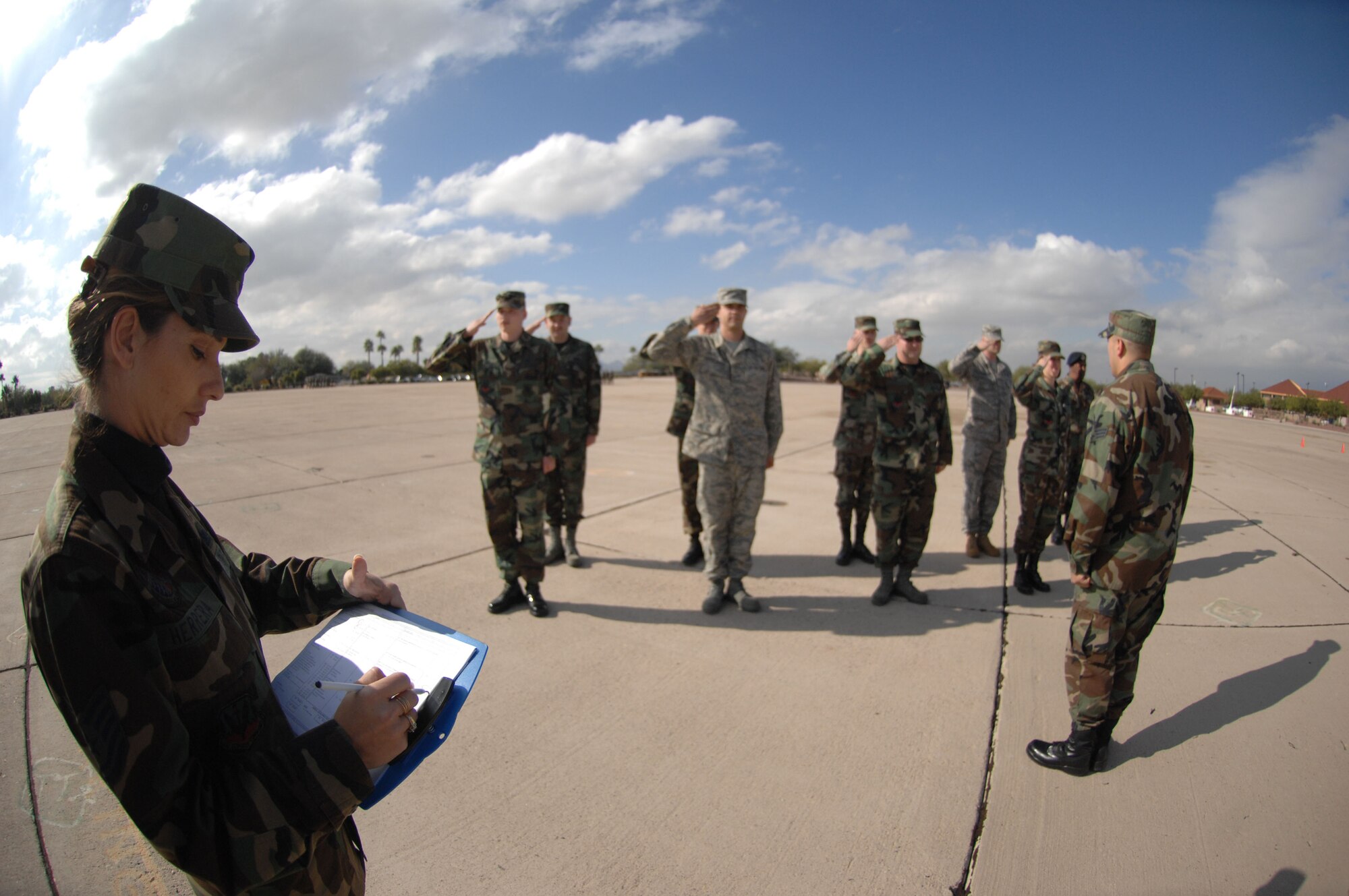 Tech. Sgt. Aubry Herrera, a member of the 355th Mission Support Squadron, evaluates a flight of Airman Leadership School Airmen on drill movements during their drill evaluations here at D-M, Dec. 11.  Sergeant Herrera won the 2007 Air Force Airman Leadership School Instructor of the Year award.  Sergeant Herrera feels honored by winning the award.  She says, “This award is truly a tribute to the team I work with.  I couldn’t have gone this far without their support.”  (U.S. Air Force photo by Senior Airman Alesia Goosic) (RELEASED) 