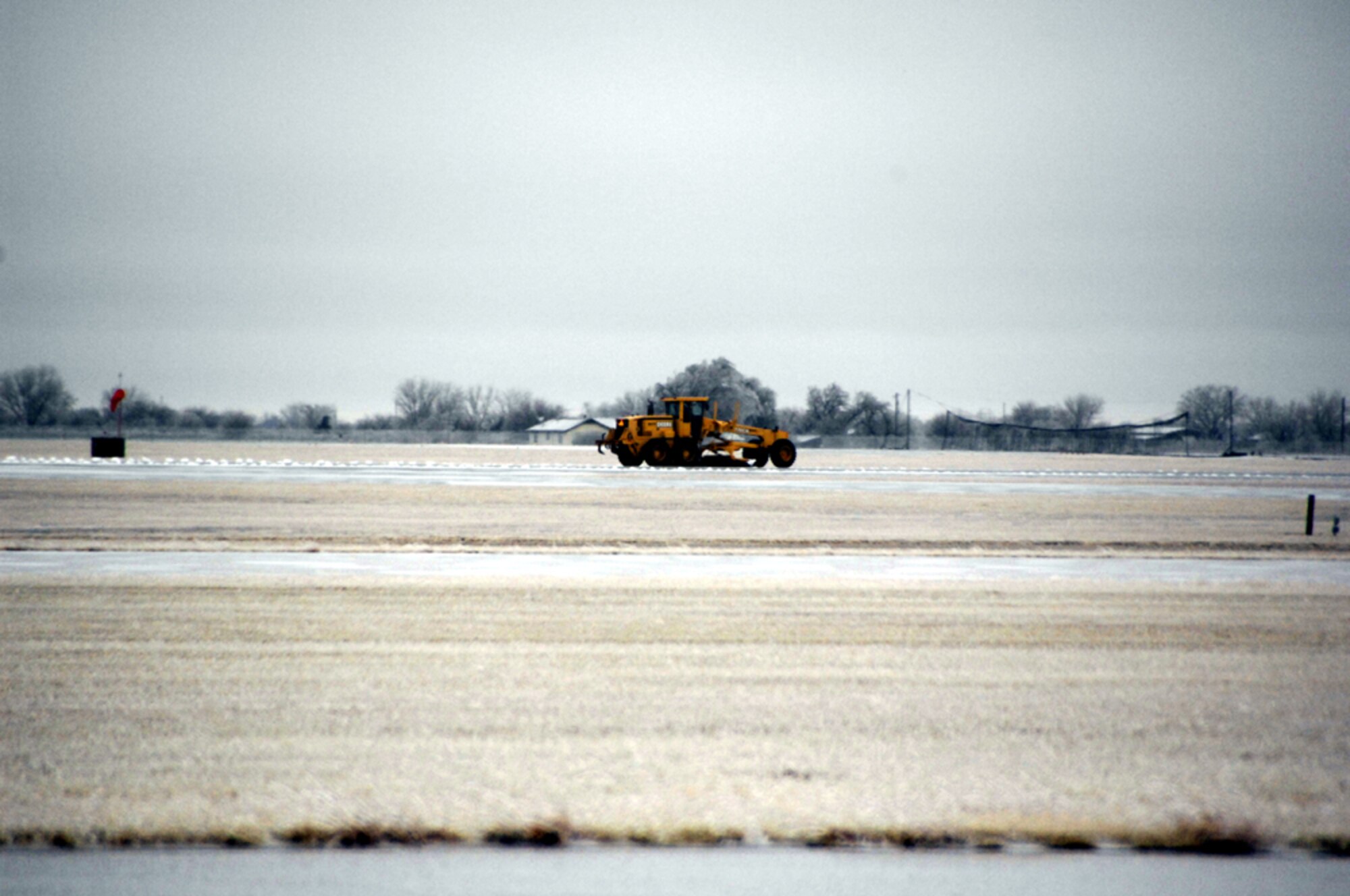 Heavy equipment operators tend to Vance Air Force Base runways. (U.S. Air Force photo by Terry Wasson)