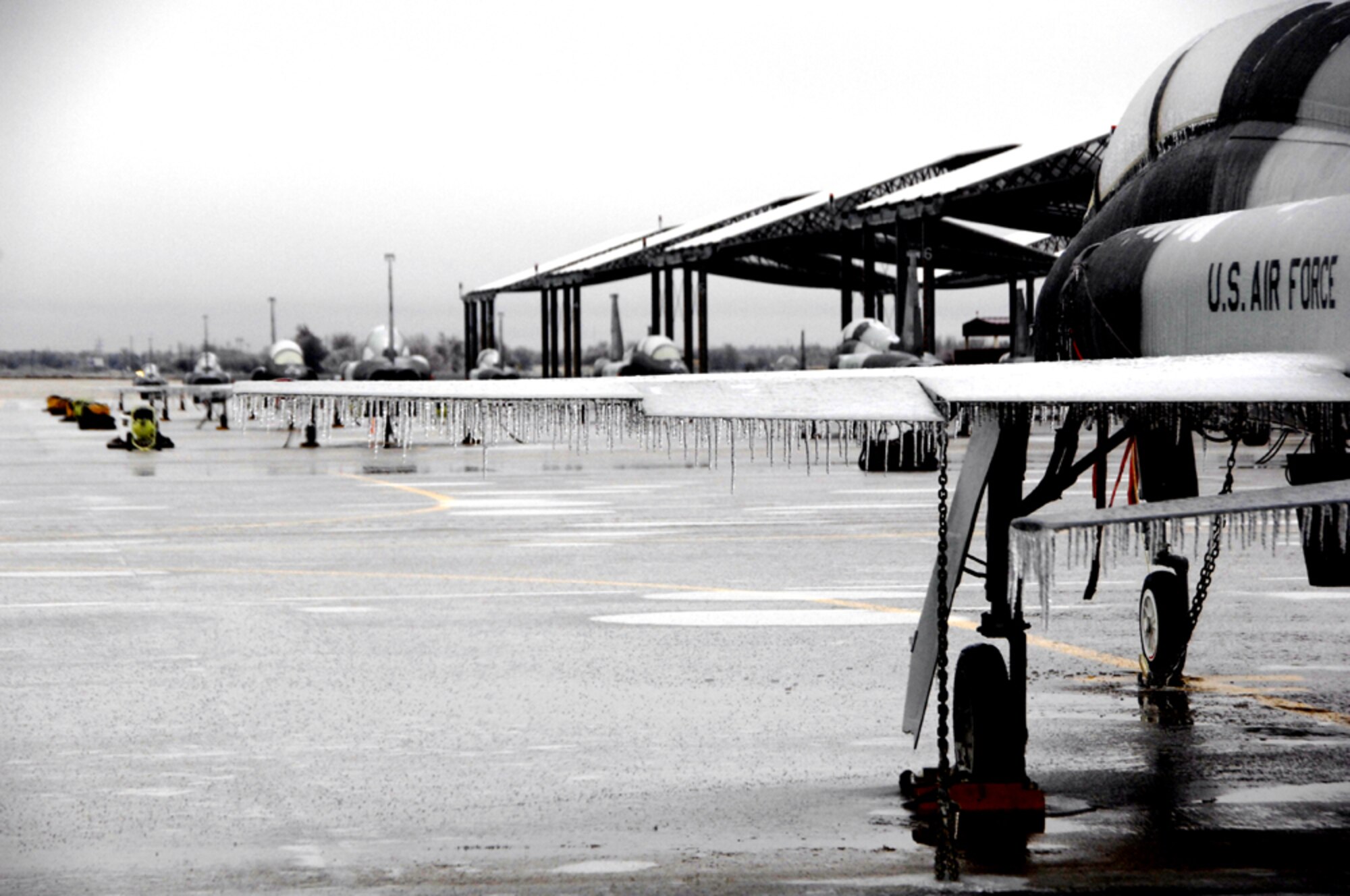 A T-38C Talon sits at Vance Air Force base as a mixture of precipitation coats surfaces across the state of Oklahoma. (U.S. Air Force photo by Terry Wasson)