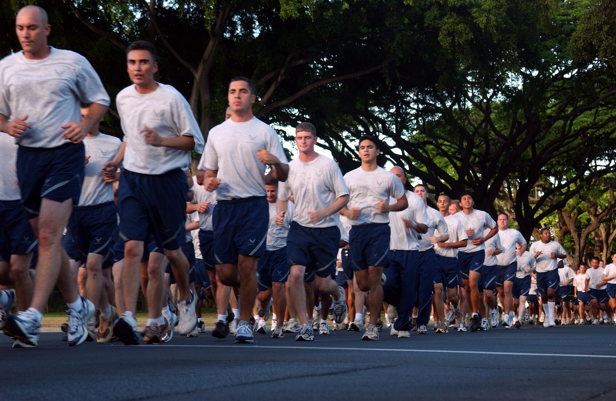 Team Hickam members make their way towards the finish line of a recent Warrior Run. The next Warrior Run is Friday at 6:30 a.m. (In Formation). Runners should form up on the grassy mall area between the 15th Airlift Wing Headquarters Building and Freedom Tower.  Guidon report is at 6:15 a.m. with the squadron flag. The  Main Child Development Center will open at 6 a.m. Photo by Staff Sgt. Erin Smith
