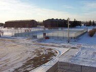 MINOT AIR FORCE BASE, N.D. -- (An aeriel view of the new base ice rink.) After three months of construction, base volunteers finished laying down the final coat of ice Dec. 7 and the new ice rink, which also doubles as a hockey rink, is ready to go. It is fully lighted, has two heavy-duty hockey goals and is open 24 hours a day, seven days a week. The rink also has safety boards surrounding the perimeter for hockey games. It is approximately half the size of a football field. (courtesy photo) 