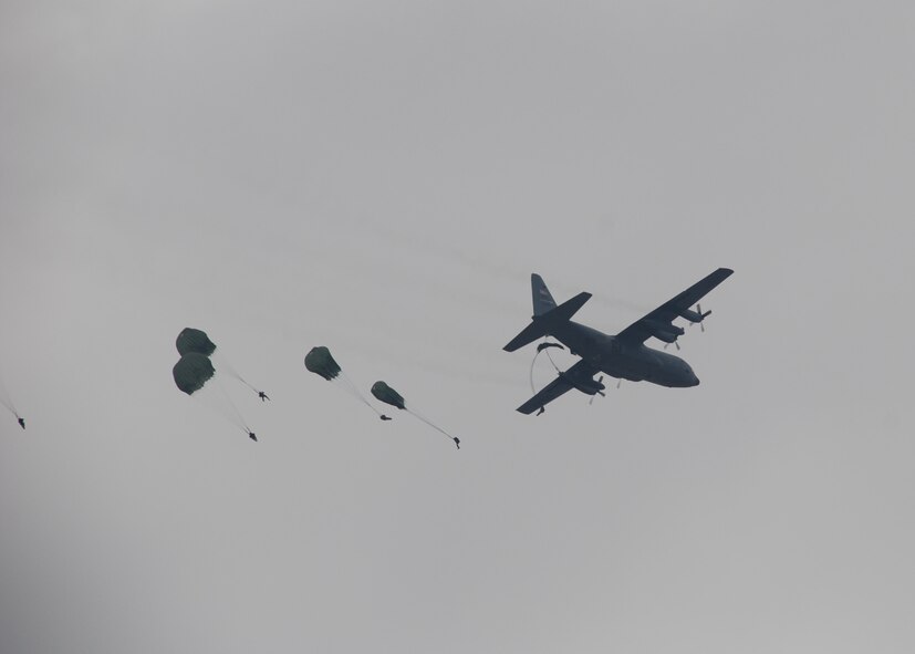 Sicily Drop Zone at Fort Bragg, N.C. -- An Air Force Reserve C-130 flown by 95th Airlift Squadron crews drops paratroopers during Operation Toy Drop. The exercise included jumpmasters from Canada, Chile and Ireland, and active duty and Reserve paratroopers and Airmen from the U.S. More than 1,050 paratroopers jumped during the exercise. (U.S. Air Force photo/Senior Airman Susan Parent)