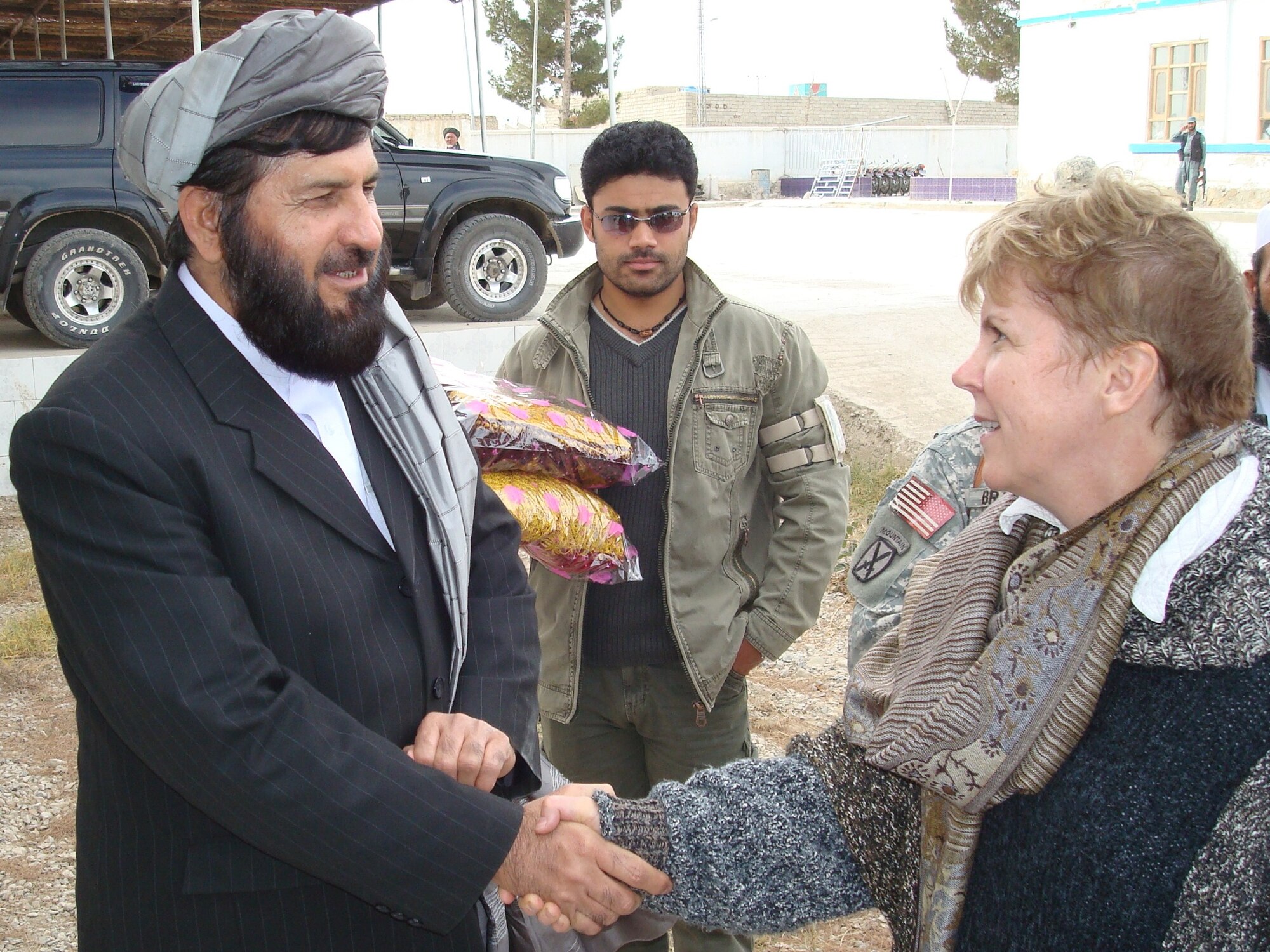 Governor Delbar Jan Arman shakes hands with Assistant Secretary-General for Peacekeeping Operations Jane Holl Lute before she departs Zabul Province Dec. 8.  The high-level visit by the UN official was designed to discuss future coordination between the UN, the United Nations Assistance Mission in Afghanistan, and the government of Afghanistan, especially in Zabul Province here.  (Air Force photo by Capt. Bob Everdeen)