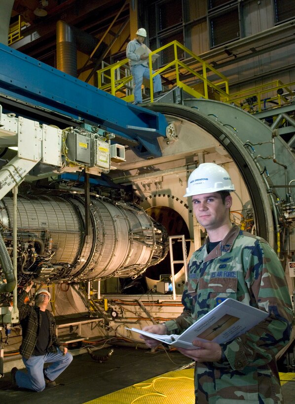 1st Lt. Josh Fredrick reviews maintenance checklists for a General Electric F101 engine being used for the initial testing of a 50-50 mix of Fisher-Trosch and JP-8 jet fuels at Arnold Engineering Development Center, Arnold Air Force Base, Tenn. The new synthetic fuel will reduce U.S. dependency on foreign oil and increase our choices for fuel. Lieutenant Fredrick is an air propulsion test project manger for the center. (U.S. Air Force photo/Staff Sgt. Bennie J. Davis III)