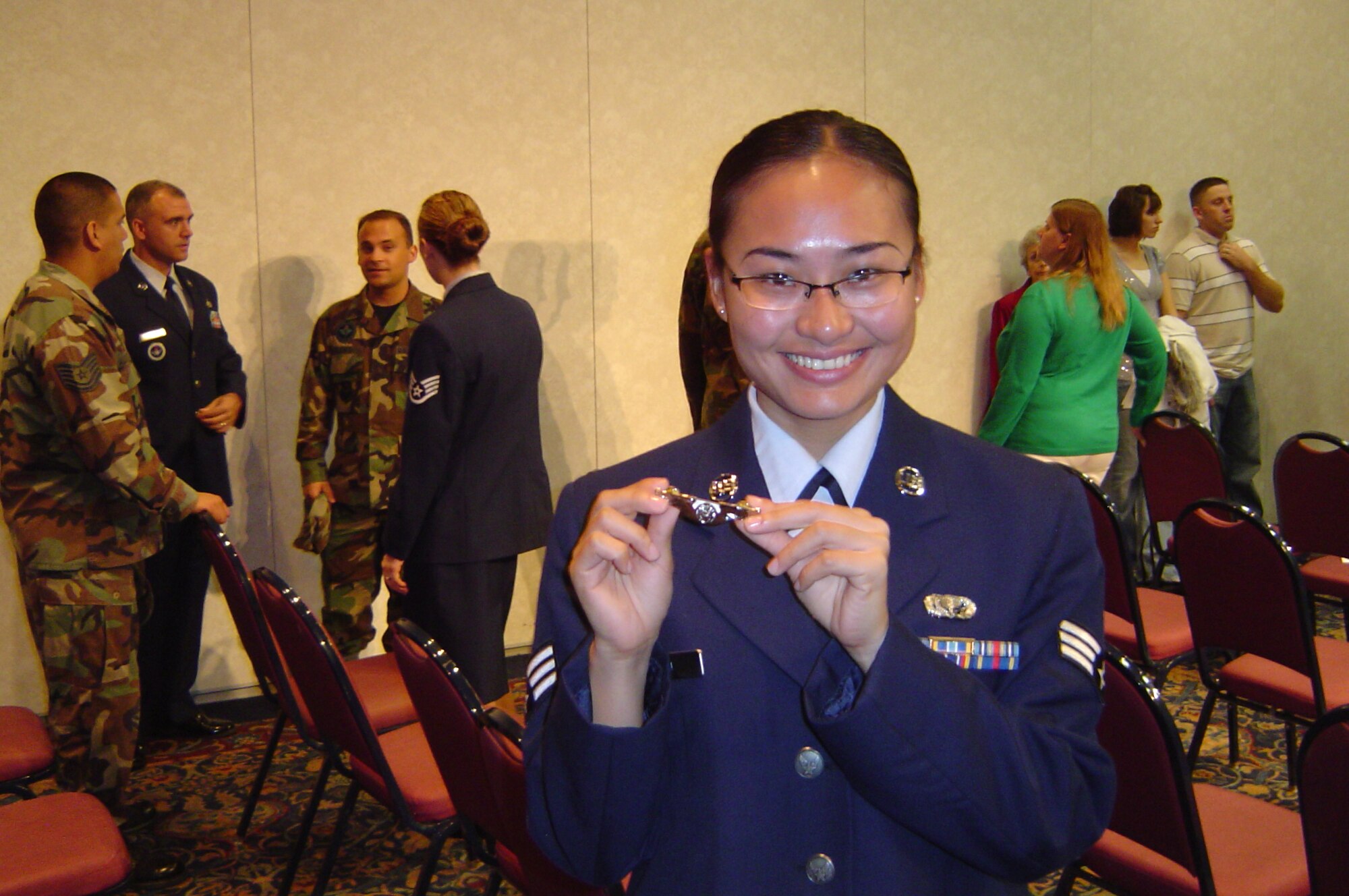 Senior Airman Yi Liu displays her enlisted aircrew wings shortly after their presentation Nov. 21. Airman Yi, a former services journeyman, is retraining to be an airborne linguist at Goodfellow. (Courtesy photo)