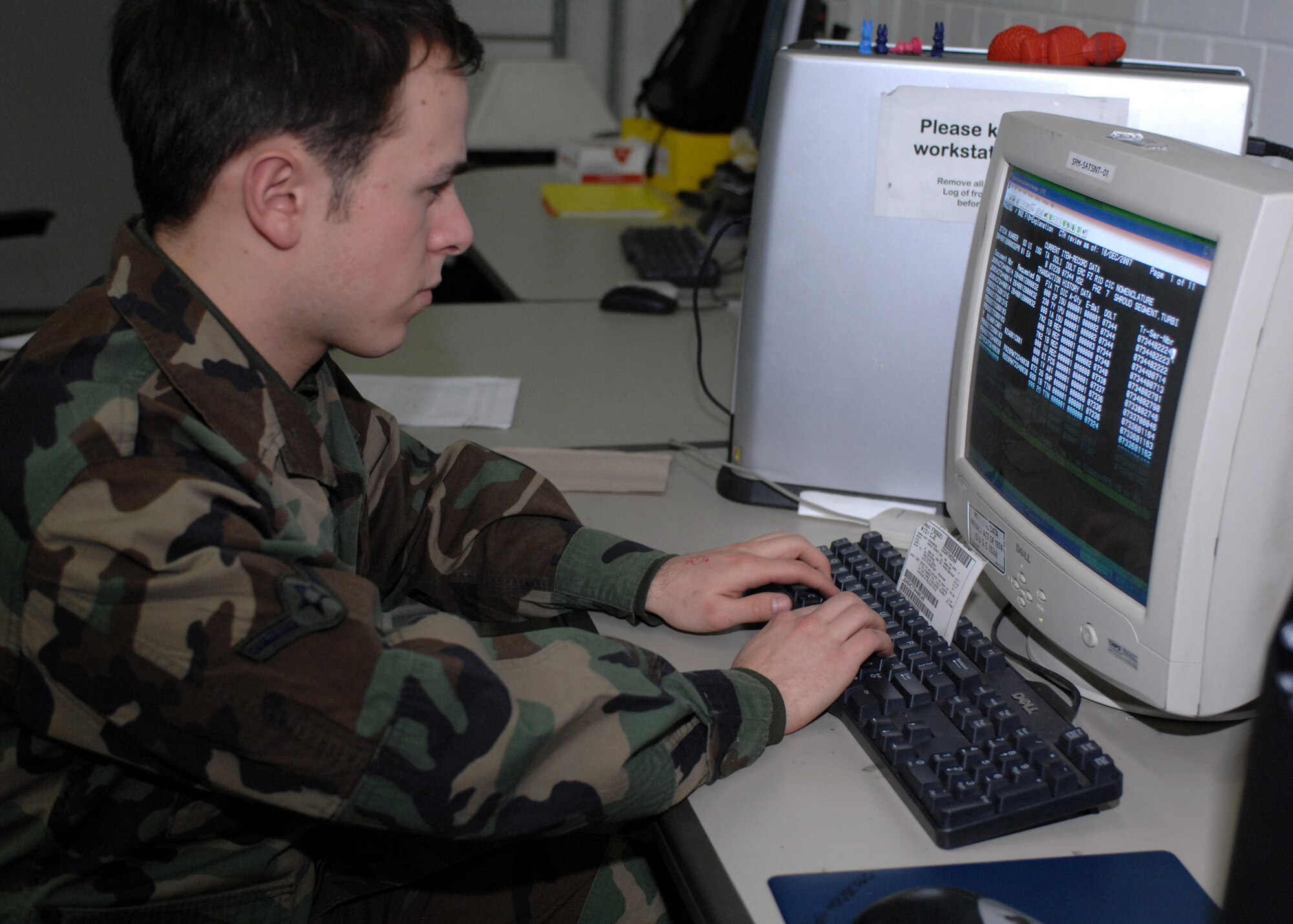 SPANGDAHLEM AIR BASE, Germany – Airman Aaron Cox, 52nd Logistics Readiness Squadron, inputs inventory data into a computer at the LRS warehouse on Spangdahlem Air Base Dec. 10, 2007. The LRS warehouse handles mechanical parts as well as office supplies. (U.S. Air Force photo/Airman 1st Class Jenifer Calhoun)
