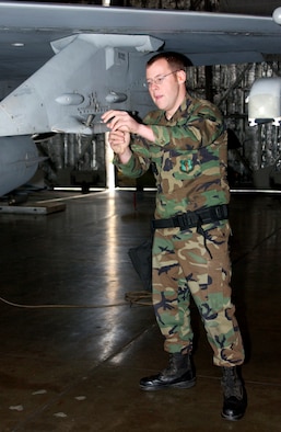 MISAWA AIR BASE, Japan -- Airman 1st Class Robert Wade, 13th Aircraft Maintenance Unit, prepares an F-16 for weapons loading during the annual Load Crew Competition here, Nov 30, 2007. Teams that compete well in the quarterly competitions are selected for the annual one. (US Air Force photo by Airman 1st Class Eric Harris)