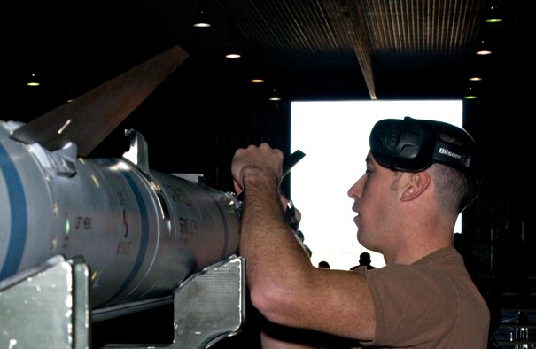 MISAWA AIR BASE, Japan -- Airman 1st Class Jolin Daigneault, 13th Aircraft Maintenance Unit, prepares an AIM 120 air-to-air missile to be loaded onto an F-16 during the annual Load Crew Competition here, Nov 30, 2007. Airman Daigneault is on the team that finished first, however the winner will not be announced until January at the 35th Maintenance Group annual awards luncheon.
(US Air Force photo by Airman 1st Class Eric Harris)