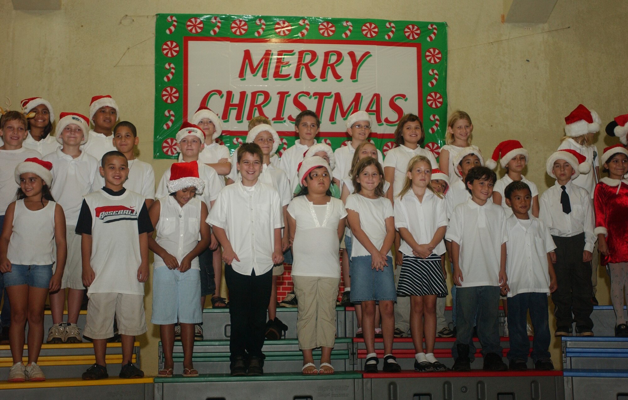 Andersen Elementary School students sing for servicemembers and their families during the annual Christmas Tree Lighting ceremony Dec. 7. The ceremony kicked off the official holiday season for Andersen. (U.S. Air Force photo/Senior Airman Brian Kimball)

