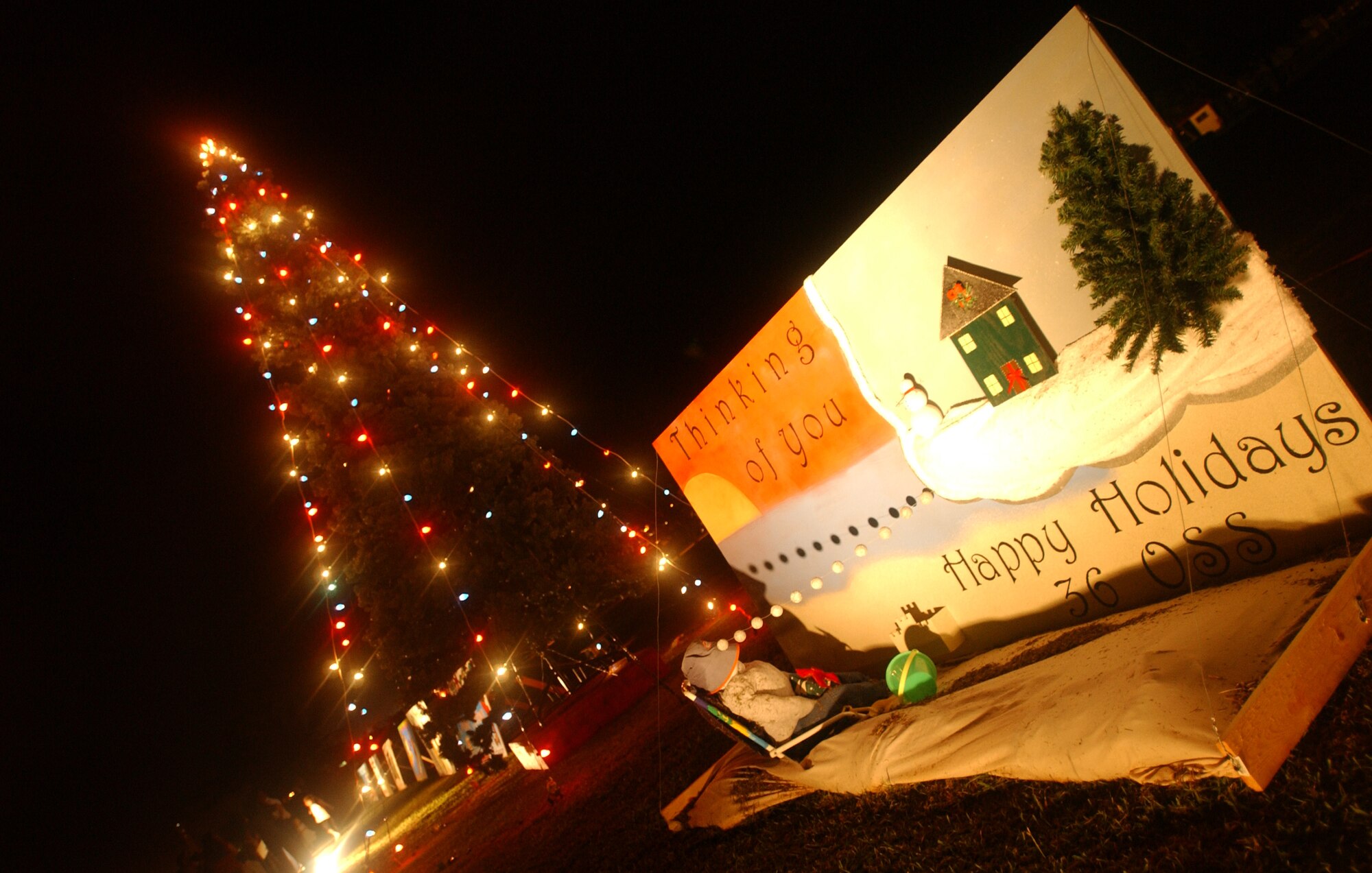 The 36th Operations Support Squadron won first place in Andersens' squadrons' giant holiday cards contest during the yearly Christmas Tee Lighting ceremony Dec. 7. (U.S. Air Force photo/Senior Airman Brian Kimball)
