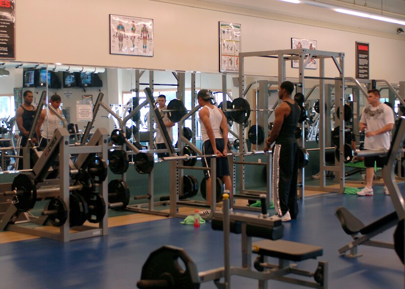 KUNSAN AIR BASE, South Korea— Airmen from the 8th Fighter Wing lift weights at the fitness center. The fitness center provides a variety of options to stay in shape this holiday season.  (U.S. Air Force Photo) 