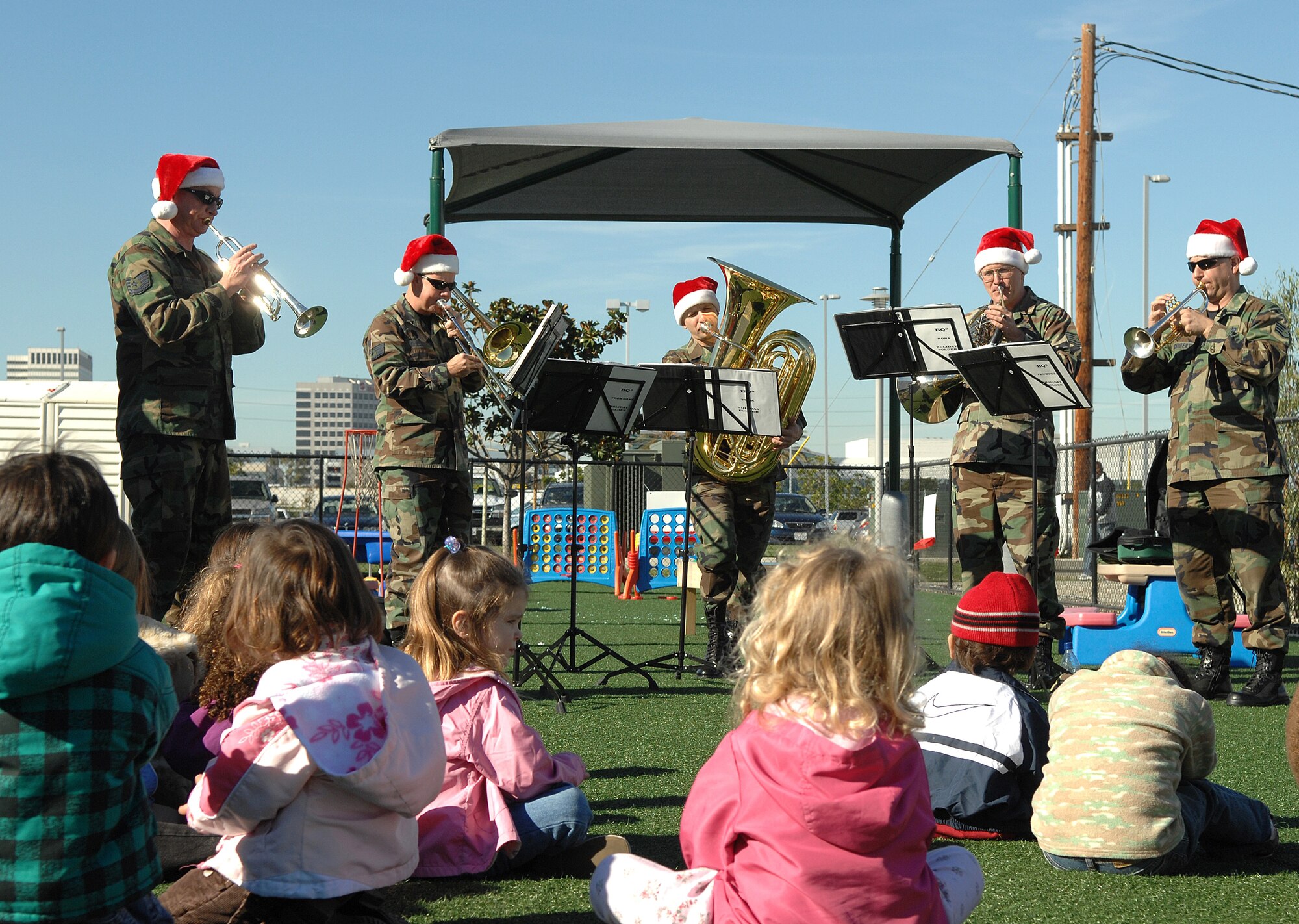 Members of the Band of the Golden West from Travis AFB performed for the CDC kids during its annual Christmas tour to spread holiday cheer to base personnel, Dec. 12.  (Photo by Stephen Schester)