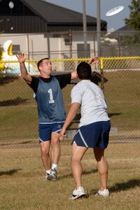 Anthony Frazier, 14th Airlift Squadron, reaches for the Frisbee during a game of ultimate Frisbee at the Fitness and Sports Center Dec. 7.  The 14 AS was playing against the 437th Civil Engineer Squadron who won the game 10-1.  (U.S. Air Force photo/Airman 1st Class Katie Gieratz)