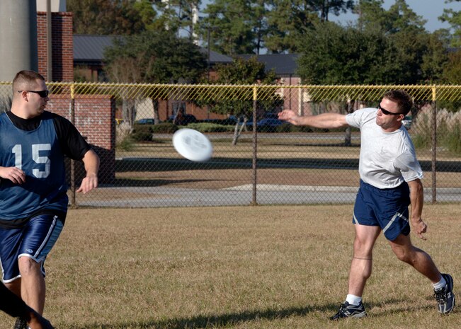 William Baird, 437th Civil Engineer Squadron, throws the Frisbee for one of his four touchdowns at the Fitness and Sports Center Dec. 7. The CES team won the game 10-1. (U.S. Air Force photo/Airman 1st Class Katie Gieratz)