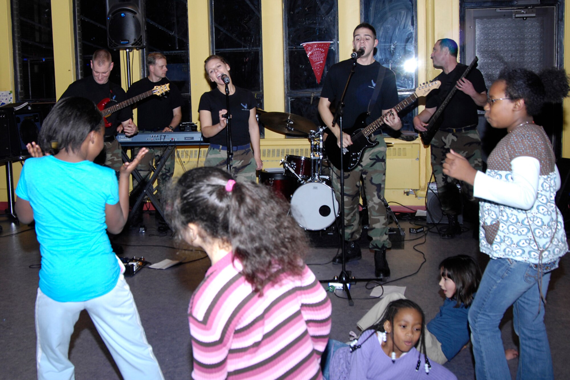 HANSCOM AFB, Mass. -- The Air Force Band of Liberty rock ensemble, Afterburner, plays at the Youth Center Dec. 11 to encourage base youth to abstain from taking drugs and drinking alcohol. The fun, safe event was sponsored by Drug Reduction Program Manager Angelita Anthony. December is National Drunk and Drugged Driving Awareness Month. (U.S. Air Force photo by Linda LaBonte Britt)