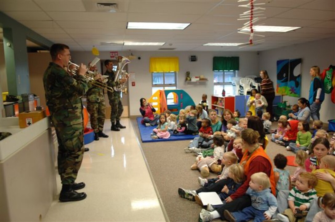 Members of the Offutt Brass share some holiday spirit as they perform for children at Ellsworth Air Force Base.  Offutt Brass is one of seven ensembles from the USAF Heartland of America Band that divided up to visit six Air Force bases in the midwest sharing the holiday spirit with military members and their families.