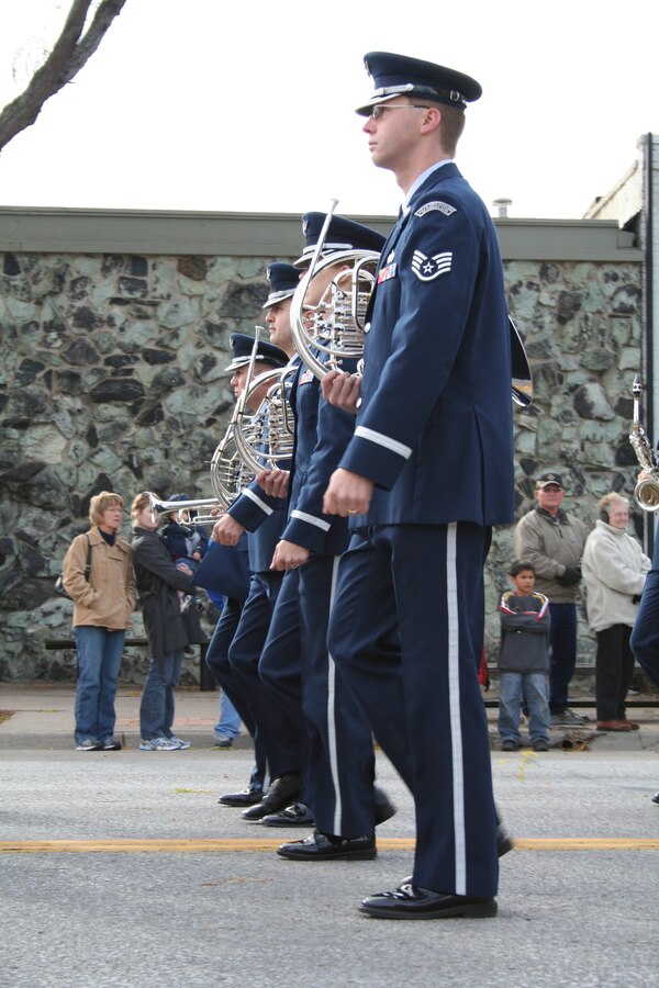 Members of the USAF Heartland of America Band all step together in the 2007 Veterans Day Parade in Bellevue, NE.  The parade is an annual event for military members stationed at Offutt Air Force, and is well-attended by the surrounding community.