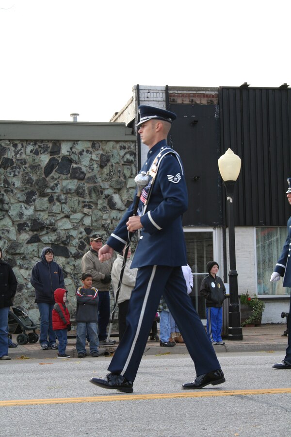 Staff Sgt. Matthew Erickson, drum major, leads the USAF Heartland of America Band as they step off in the 2007 Veterans Day Parade in Bellevue, NE.  The parade is an annual event for military members stationed at Offutt Air Force, and is well-attended by the surrounding community.