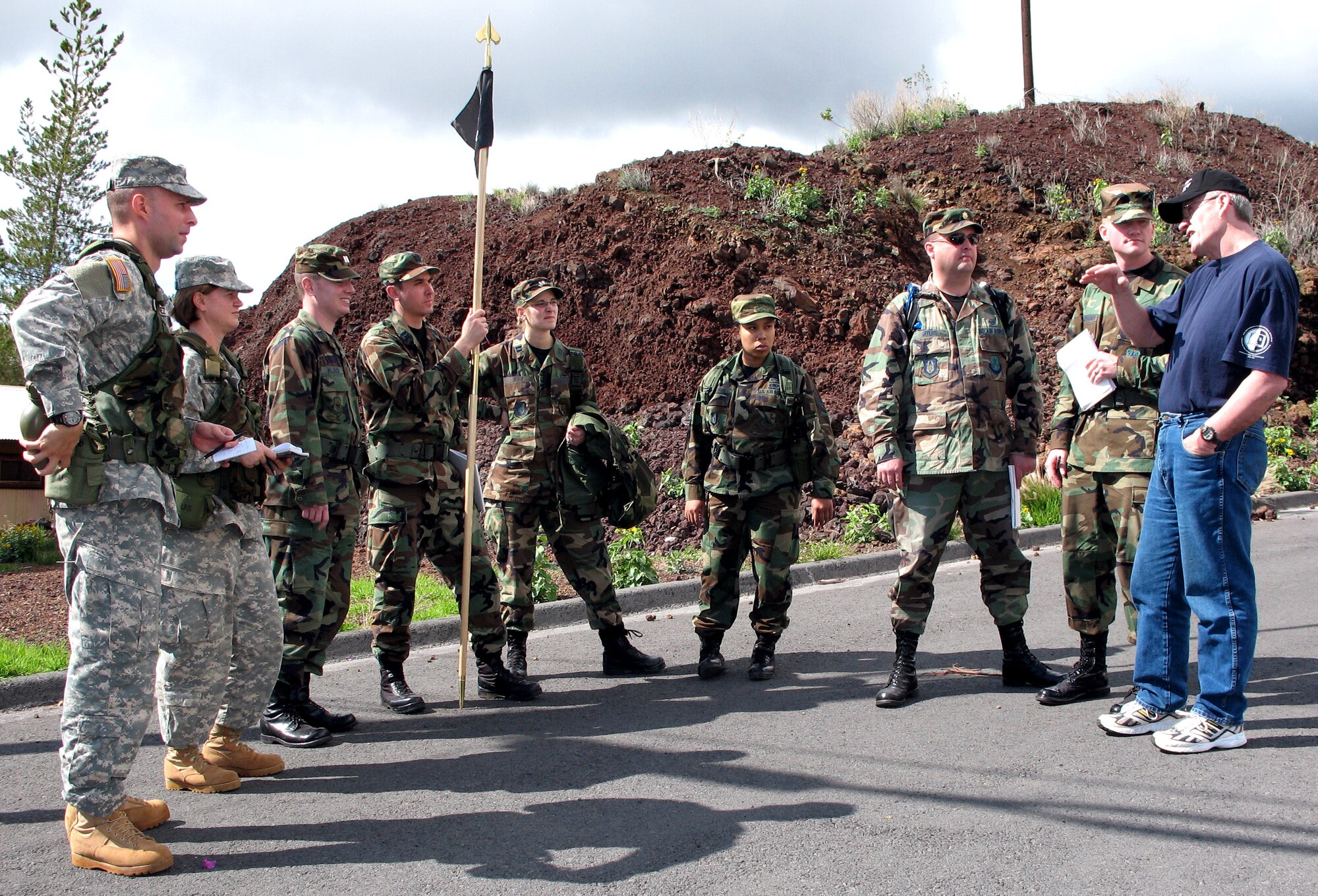 After posing as a non-governmental official in a legal scenario, Canadian Army Maj. Warren Fenser provides feedback Dec. 10 to students of the Pacific Joint Operations Legal Exercise, or PACJOLE, at the Pohakuloa Training Area on the island of Hawaii. PACJOLE is a Pacific Air Forces exercise involving legal Soldiers, Marines and Airmen from all over the Pacific theater. (U.S. Air Force photo/Tech. Sgt. Chris Vadnais)