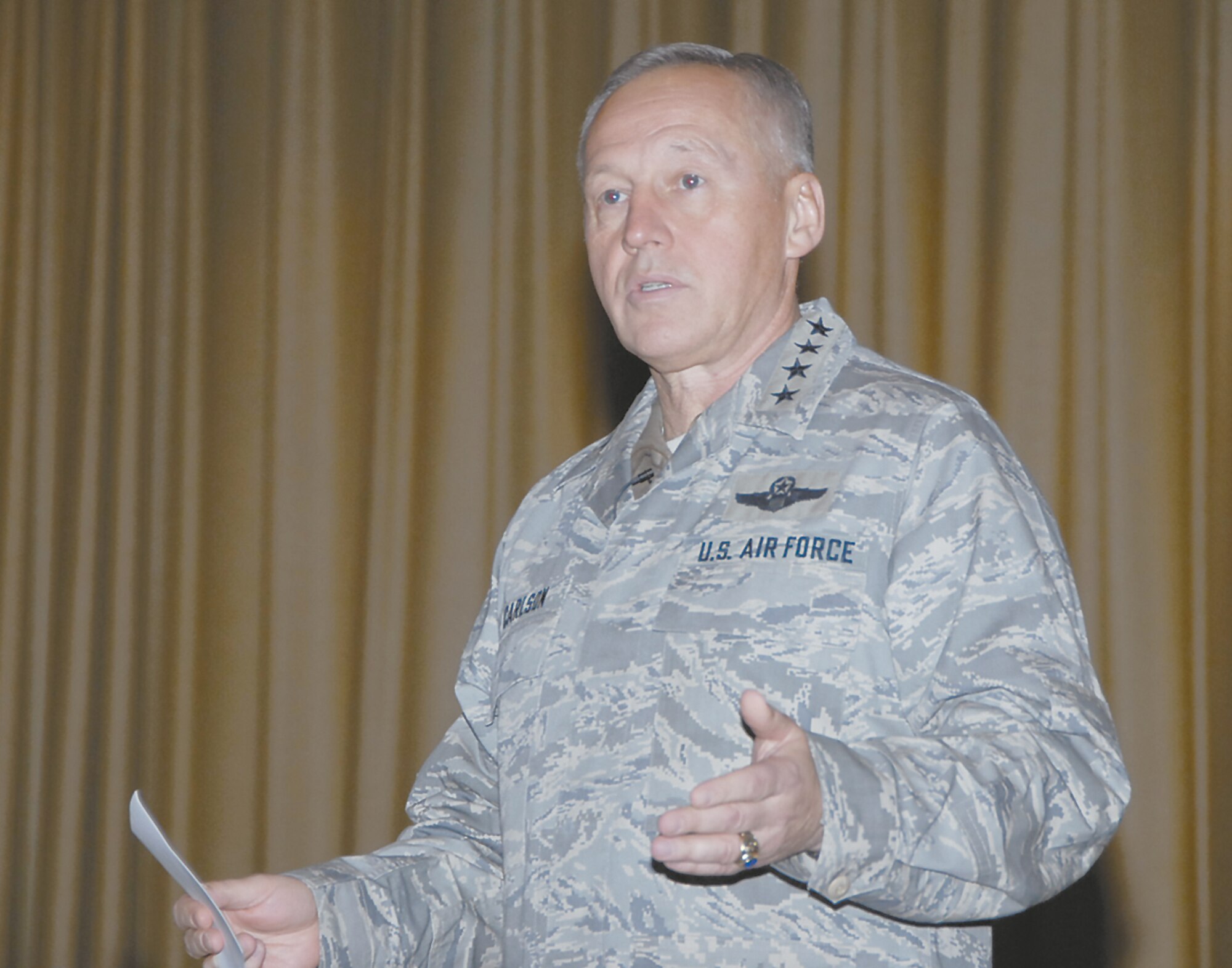 Gen. Bruce Carlson addresses the audience at Monday's Enlisted Call at the base theater.  (Skywrighter photo by Christy Webb)