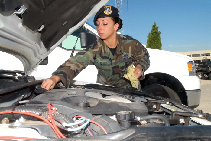 Senior Airman Chrystal Pascalli, 437th Security Forces Squadron vehicle control NCO, inspects the engine of a security forces? patrol vehicle.  Airman Pascalli recently was selected as Air Mobility Command Security Forces Outstanding Security Forces Support Staff Airman. (U.S. Air Force photo Staff Sgt. Jennifer Arredondo)