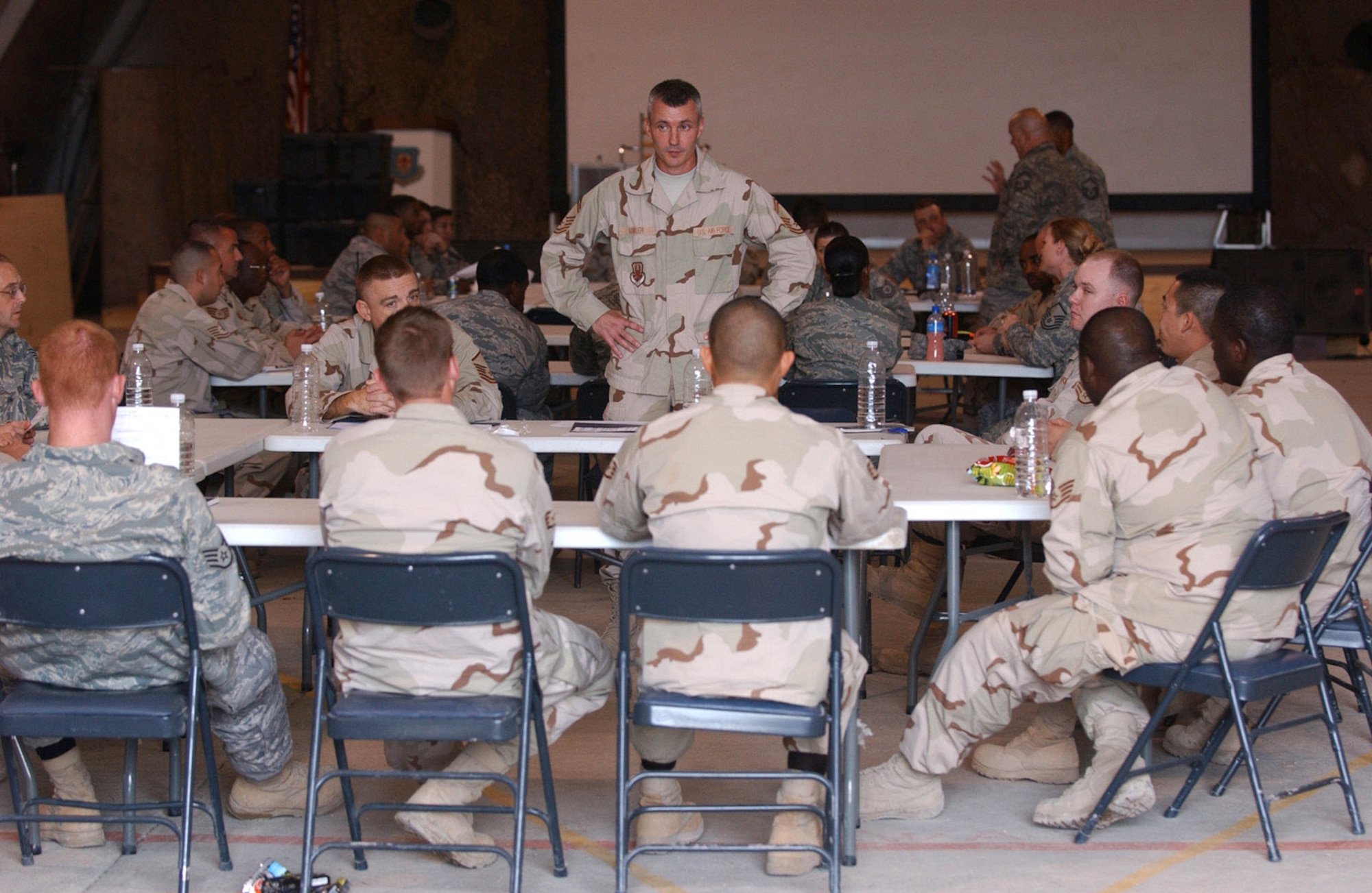 Senior Master Sgt. Vincent Marler shares his knowledge and experience with mid-tier NCOs in an open forum atmosphere with the senior enlisted force Dec. 8 at Ali Base, Iraq. The Top 3 Council hosted a Senior NCO Mentorship Seminar for mid-tier enlisted Airmen. Sergeant Marler is assigned to the 407th Expeditionary Operations Support Squadron and is deployed from Whiteman Air Force Base, Mo. (U.S. Air Force photo/Airman 1st Class Jonathan Snyder) 
