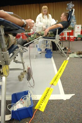 SHAW AIR FORCE BASE, S.C. -- Teresa Altman, American Red Cross Phlebotomy technician, prepares the arm of Staff Sgt. James Bojonny, 20th Logistics Readiness Squadron, for blood donation Dec. 11. The American Red Cross exceeded its blood drive goal of 45 units by 18. The donations will be stored at Toumey Regional Medical Center for the Sumter community. (U.S. Air Force photo/Airman 1st Class Kathrine McDowell)