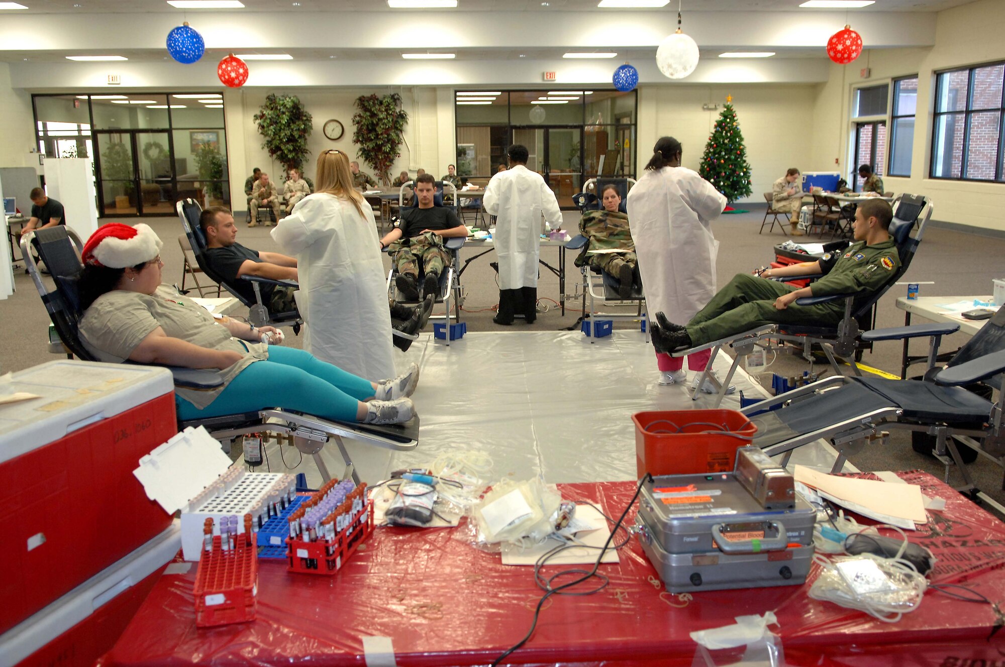 SHAW AIR FORCE BASE, S.C. -- Shaw personnel and their families donate blood Dec. 11 for the American Red Cross blood drive at the community activities center. The Red Cross exceeded its goal of 45 units of blood by 18. The donations will be stored at Toumey Regional Medical Center for the Sumter Community. (U.S. Air Force photo/Airman 1st Class Kathrine McDowell)