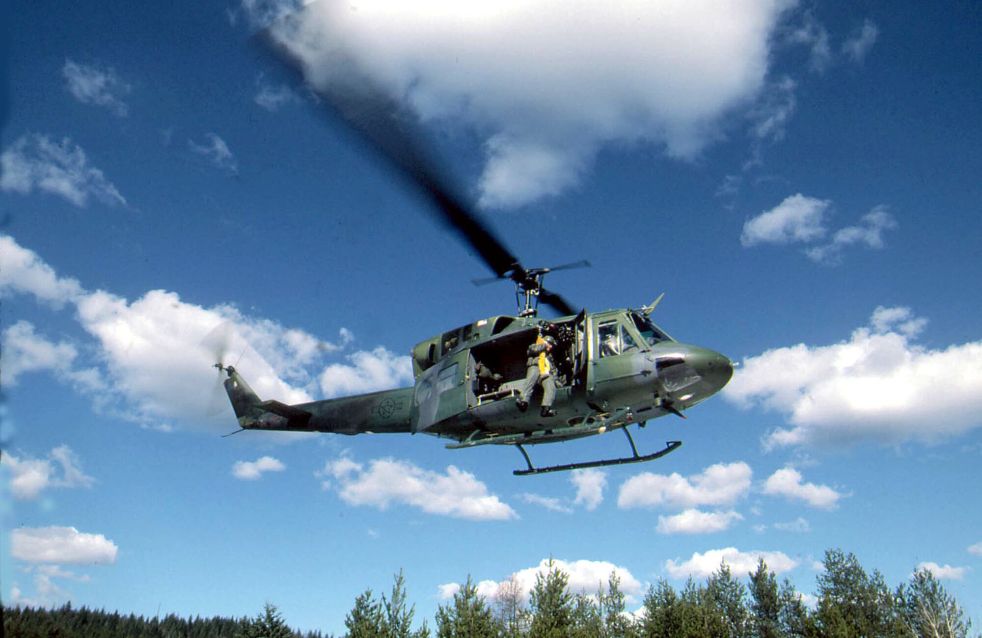 A four-member UH-1N Huey crew from Fairchild Air Force Base, Wash., rescued a stranded hiker Dec. 4 after an avalanche killed two others hit in the Snoqualmie Pass area in Washington. The crew consisted of Capt. Amanda Somerville, the pilot; Capt. Evan Roth, the co-pilot, Tech. Sgt. Devin Fisher, the flight engineer; and Staff Sgt. Jason Weiss, the independent duty medical technician. The Airmen are assigned to the 36th Rescue Flight. (U.S. Air Force photo/Staff Sgt. Andy Dunaway) 
