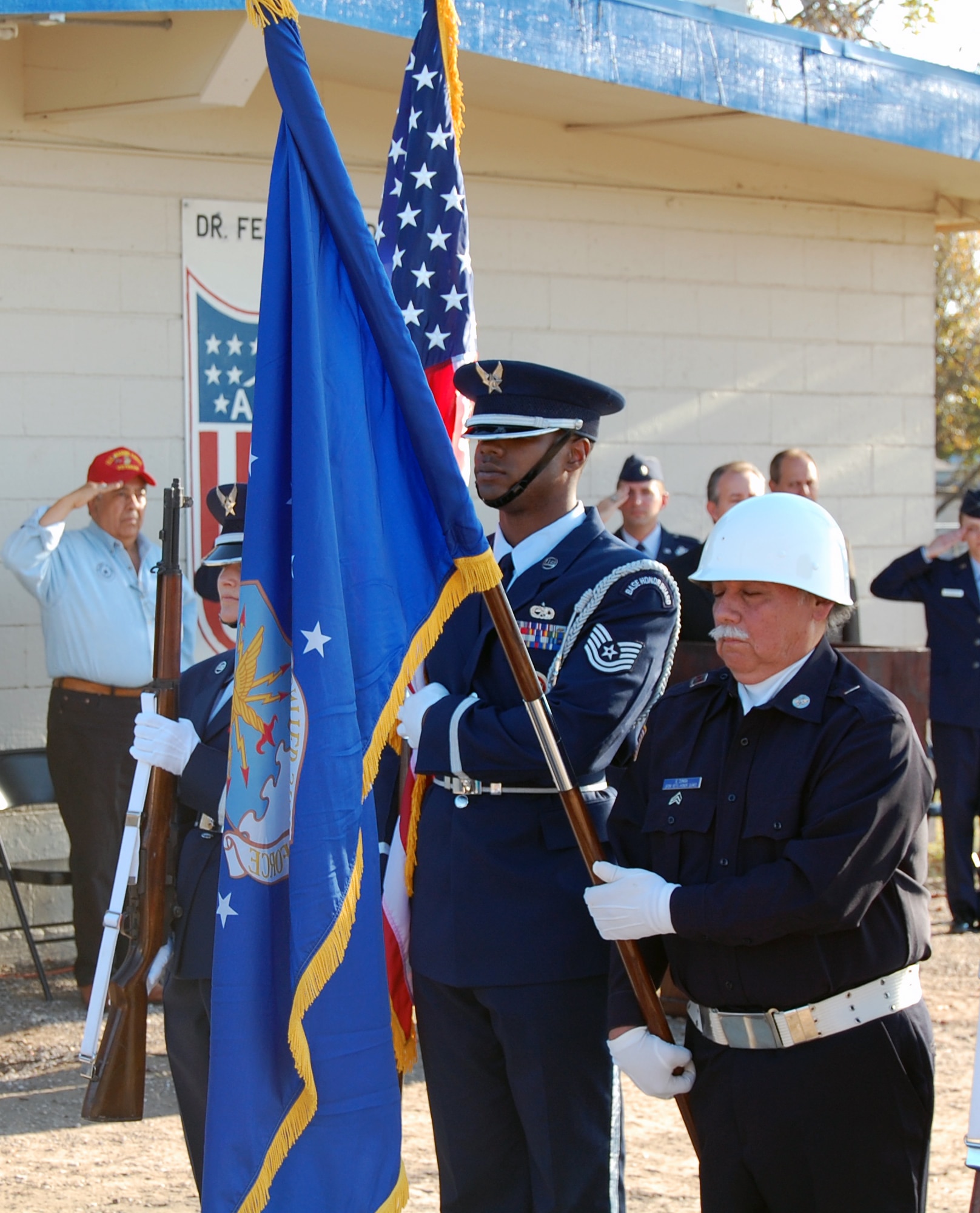 LAUGHLIN AIR FORCE BASE, Texas – Tech. Sgt. Antonio Washington, Honor Guard non-commissioned officer in charge, and San Felipe Del Rio Veteran Honor Guard present arms during Del Rio’s Pearl Harbor Day Remembrance Ceremony Dec. 7. The Ceremony was held in order to acknowledge Pearl Harbor Survivors, veterans and local Military Members. (U.S. Air Force photo by Tech. Sgt. Joel Langton)