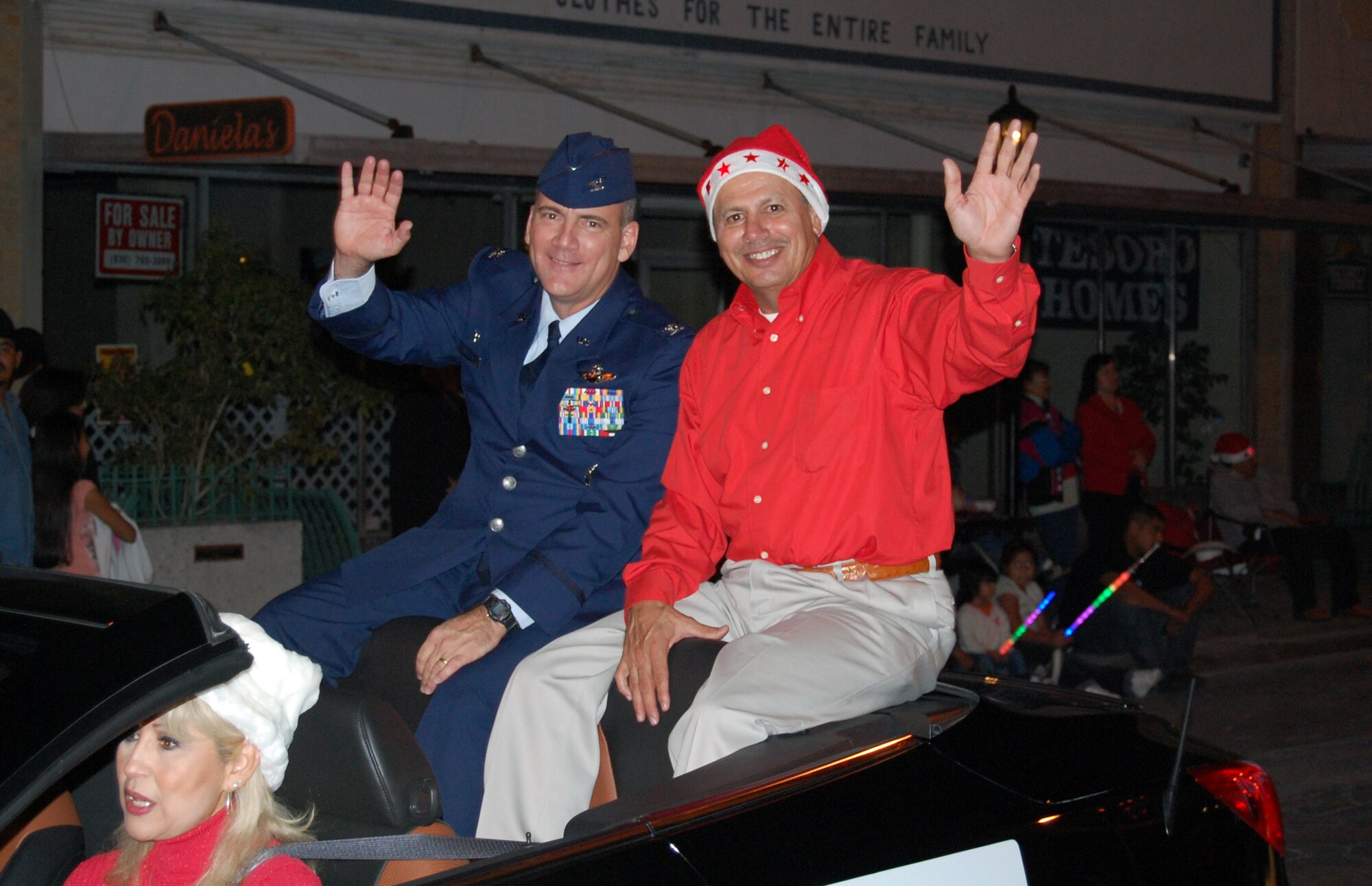 LAUGHLIN AIR FORCE BASE, Texas – Col. John Doucette, 47th Flying Training Wing Commander and Del Rio Mayor Efrain Valdez ride along in the Del Rio Christmas Parade Dec. 8. Many Laughlin members came out to support the community with a formation of Airman, a fire truck with Santa and much more. (U.S. Air Force photo by Tech. Sgt. Joel Langton)