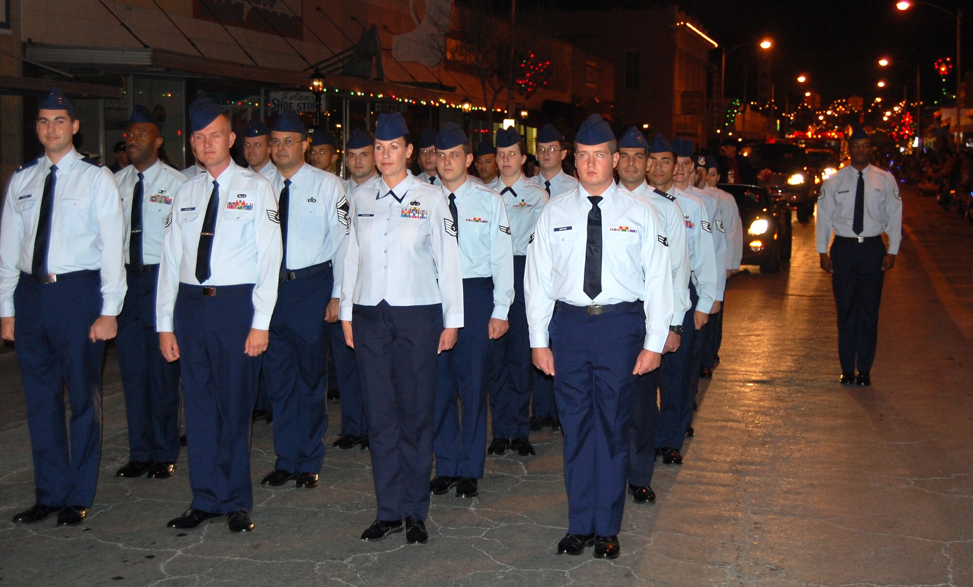 LAUGHLIN AIR FORCE BASE, Texas –A formation of Airman led by Tech. Sgt. Antonio Washington, Honor Guard non-commissioned officer in charge, follow in the Del Rio Christmas Parade Dec. 8. Many Laughlin members came out to support the community with a formation of Airman, a fire truck with Santa and much more. (U.S. Air Force photo by Tech. Sgt. Joel Langton)