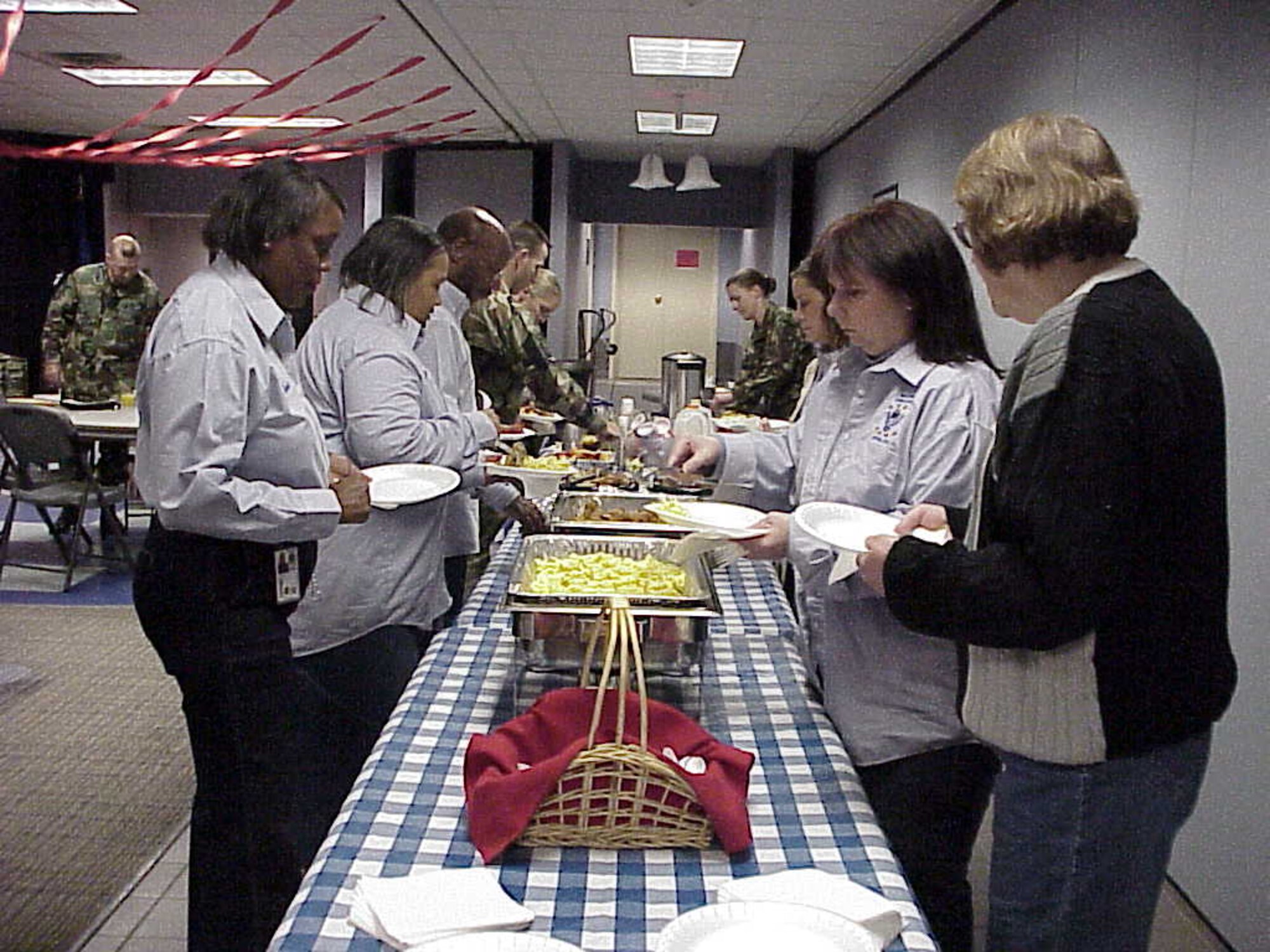 Members of the Airman and Family Readiness Center staff prepare to eat breakfast prior to the annual Airman's Holiday Cookie Drive Dec. 6.  (Courtesy photo)