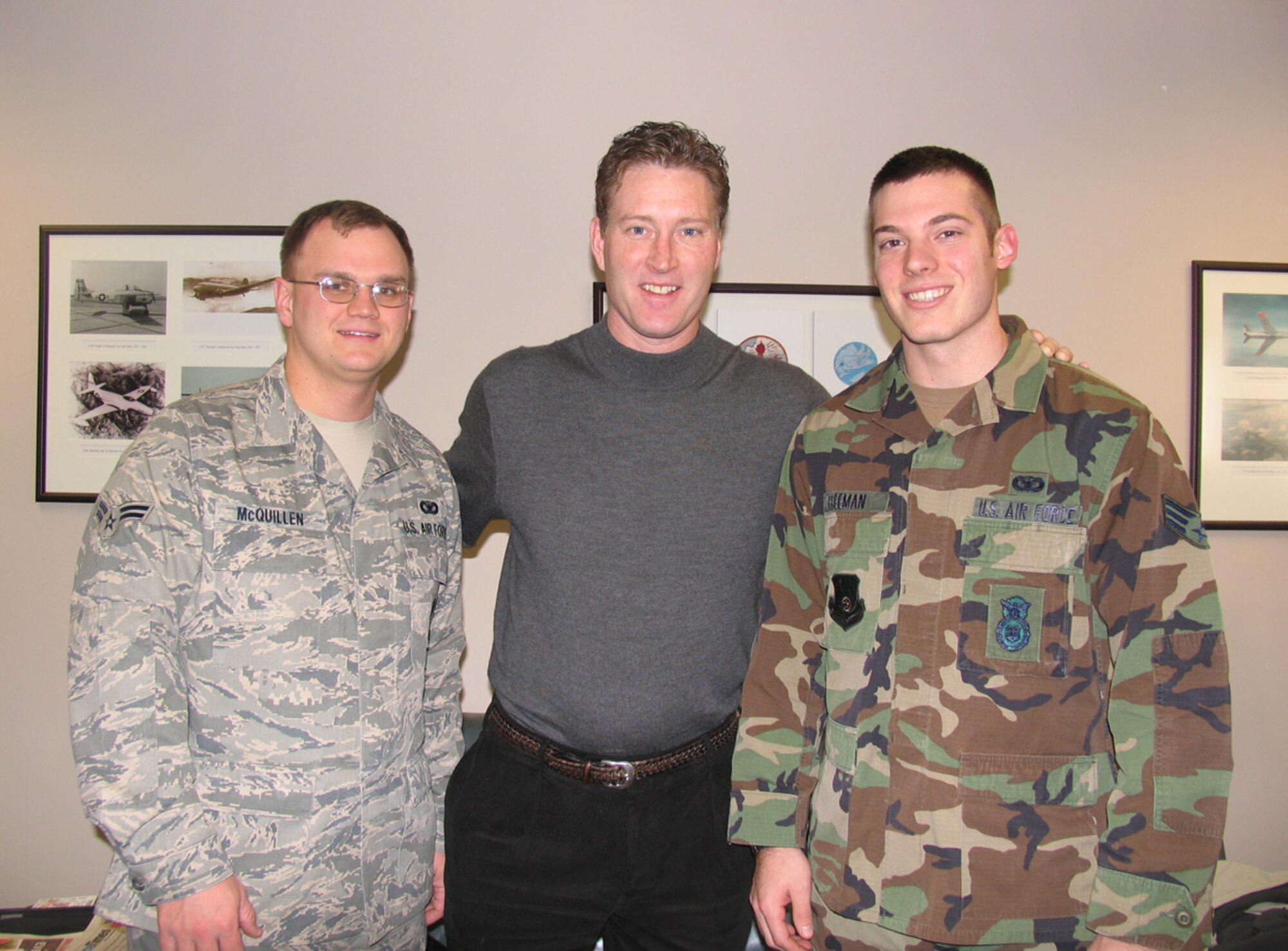 HANSCOM AFB, Mass. – Former Boston Bruins player Bob Sweeney (center) visited Hanscom on Dec. 11 to deliver tickets for an upcoming Boston Bruins game to Airmen honored at last week’s Heroes’ Homecoming celebration. Airman 1st Class Luke McQuillen (left), and Senior Airman Douglas Freeman (right), both from the 66th Security Forces Squadron had an opportunity to meet Mr. Sweeney during his base visit.(U.S. Air Force photo by 2nd Lt. Michaela Walrond)