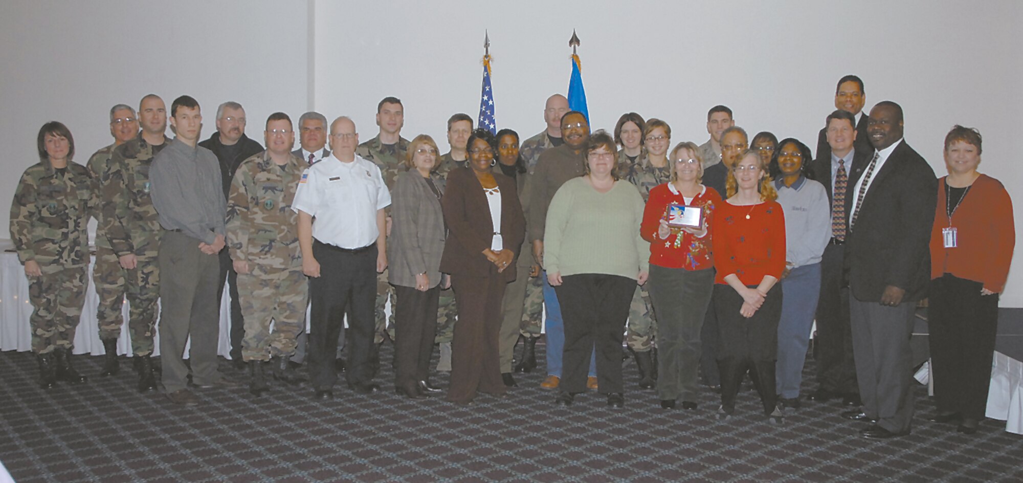 Members of the 88th Air Base Wing receive their plaque for their contributions to CFC.  (Skywrighter photo by Christy Webb)