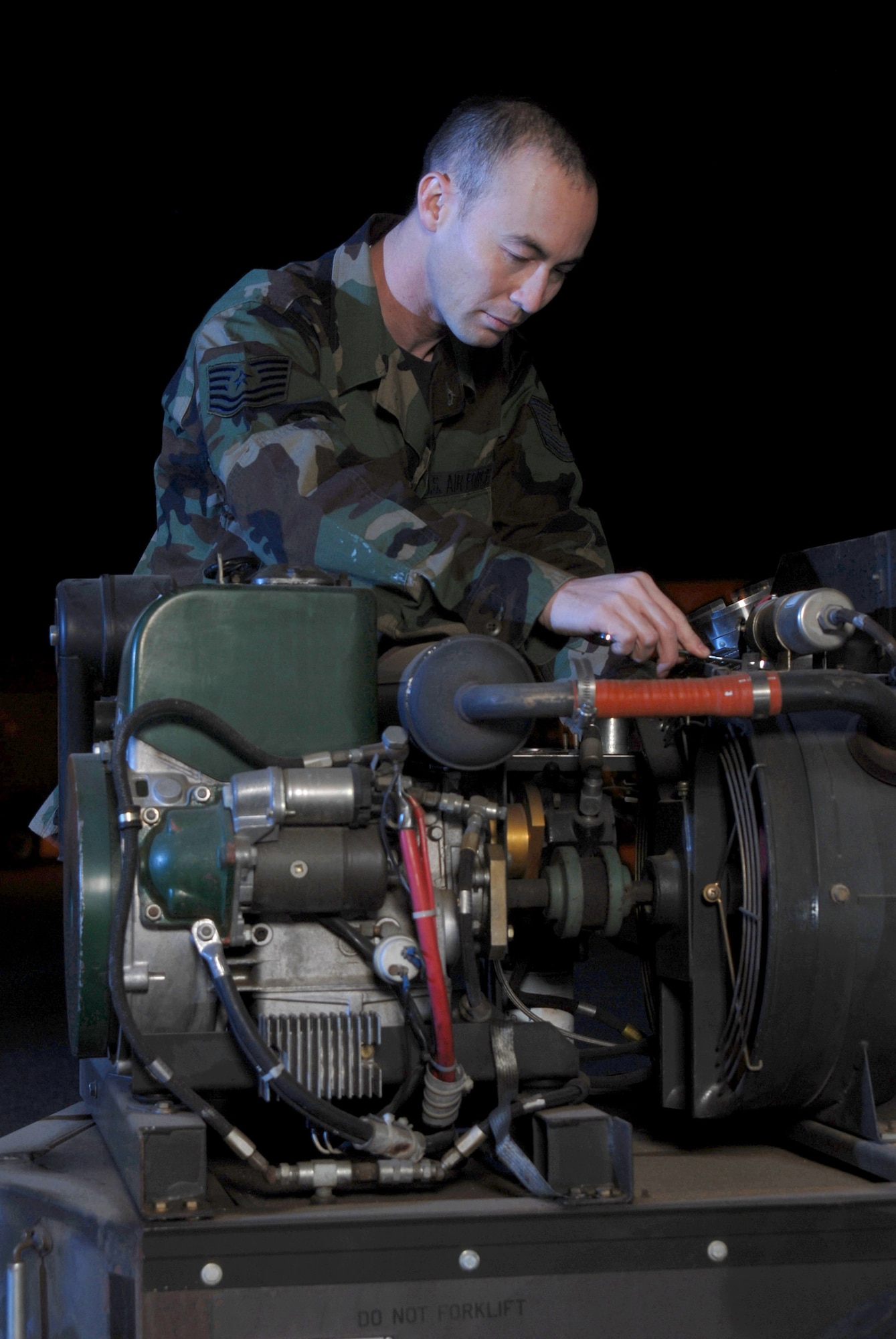 Tech. Sgt. Tom Wilson inspects a portable ground shelter heater Dec. 5 at March Air Reserve Base, Calif. Sergeant Wilson, an aircraft generation equipment technican from the 452nd Maintenance Squadron, is an air Reserve technician here. Air Reserve technicians are full-time civilian employees of the Air Force who must maintain active status as reservists in an Air Force Reserve unit. They are permanent employees who, in the event of mobilization, are available for active duty in their assigned military position. They are essential for the operational readiness of their Reserve unit. (U.S. Air Force photo/Val Gempis)
