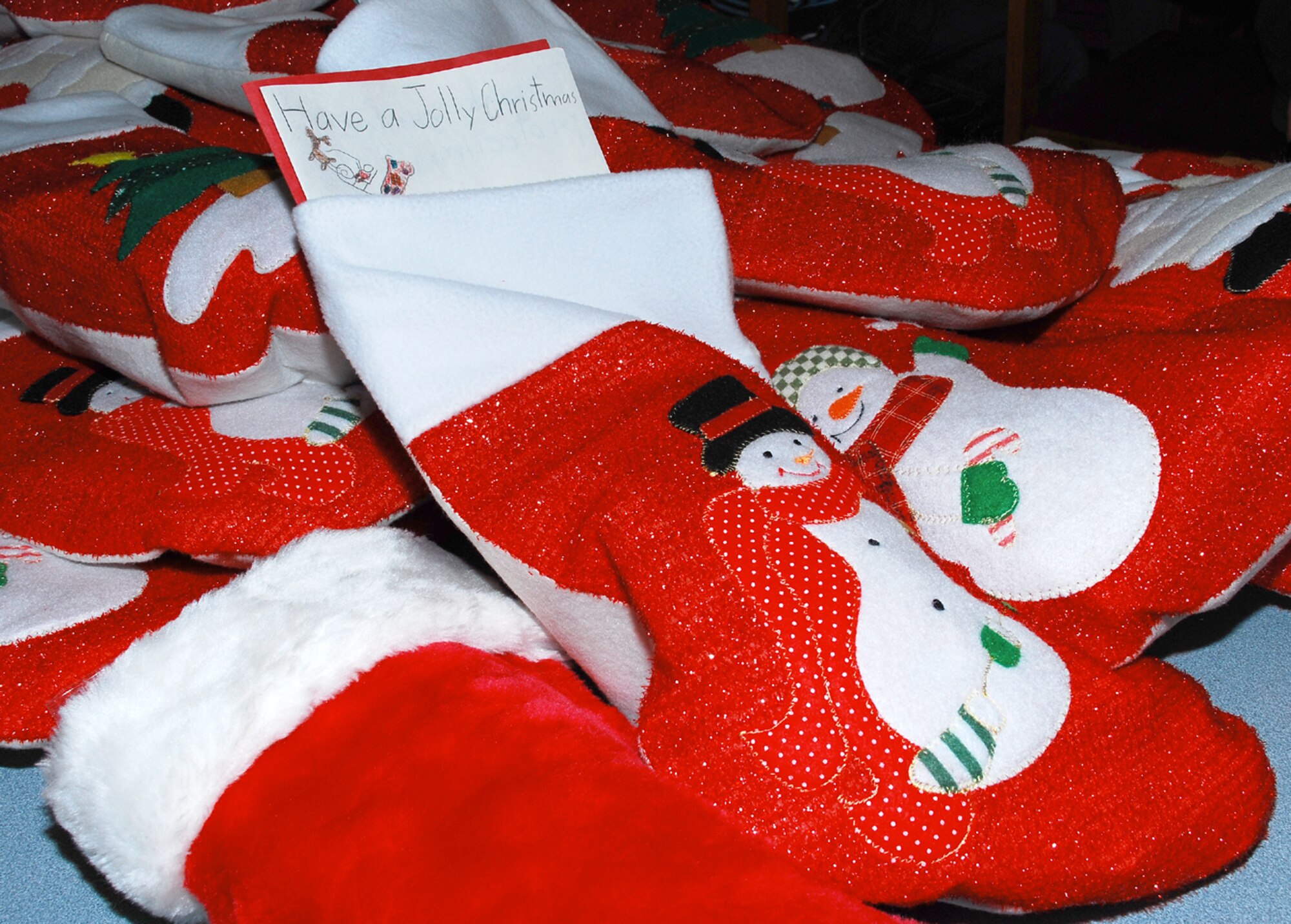 Children at the Columbia Elementary School at McGuire AFB gathered together recently to prepare 30 stockings to send overseas in a program dubbed "Stockings for Soldiers". Each stocking contained a Christmas card hand-made by a child at the school, as well as goodies such as candy and useful items like lip balm. (U.S. Air Force photo/Senior Airman Danielle Johnson)