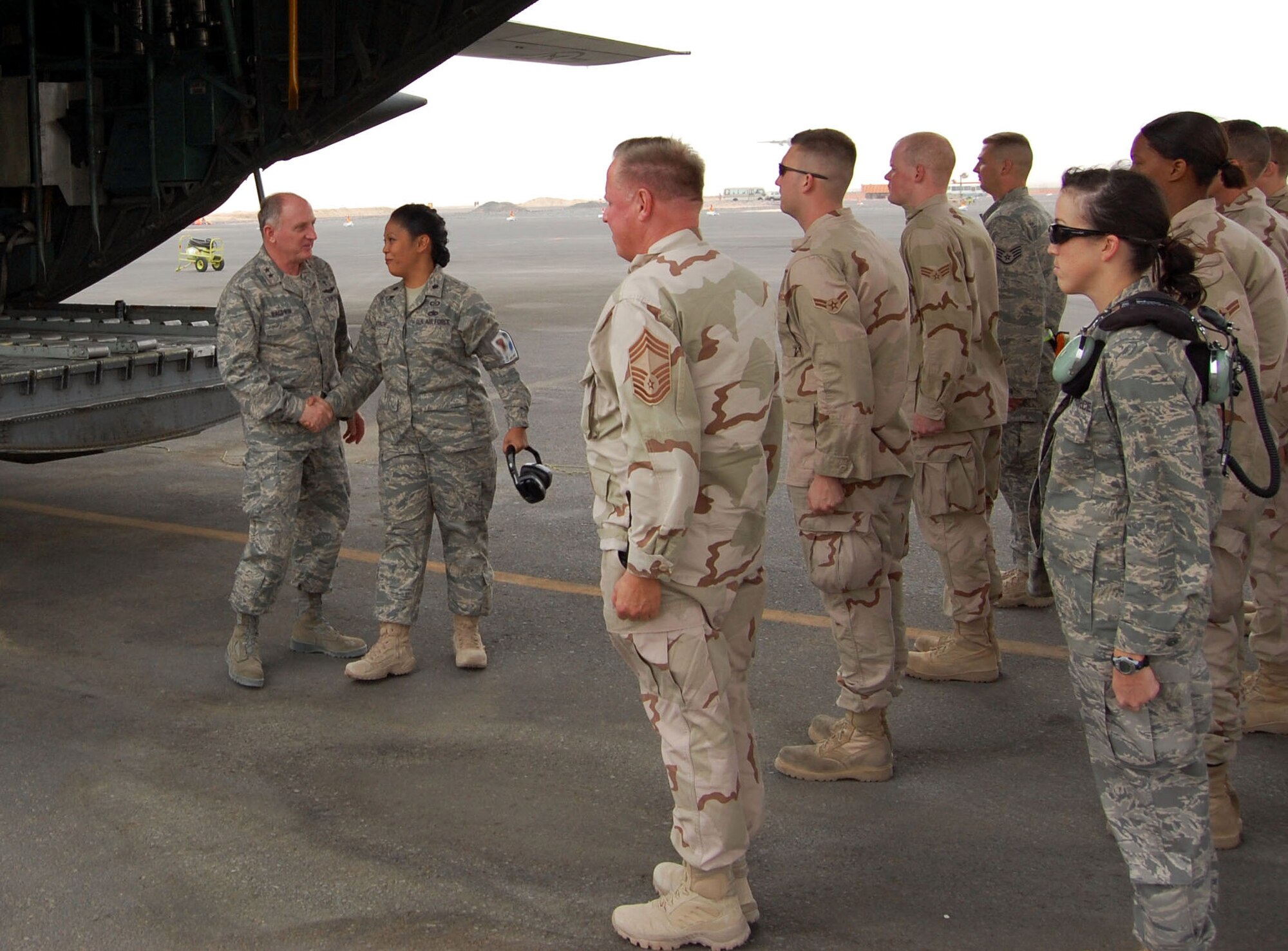 SOUTHWEST ASIA – Lt. Col. Shirlene Ostrov introduces Maj. Gen. Charles Baldwin, to a formation of aircraft maintainers at an air base in the Middle East Nov. 6. Colonel Ostrov is the 386th Expeditionary Aircraft Maintenance Squadron commander and is from Scott Air Force Base, Ill. Chaplain Baldwin is the Air Force’s chief of chaplains. (Air Force photo\ Staff Sgt. Phillip Butterfield) 
 
