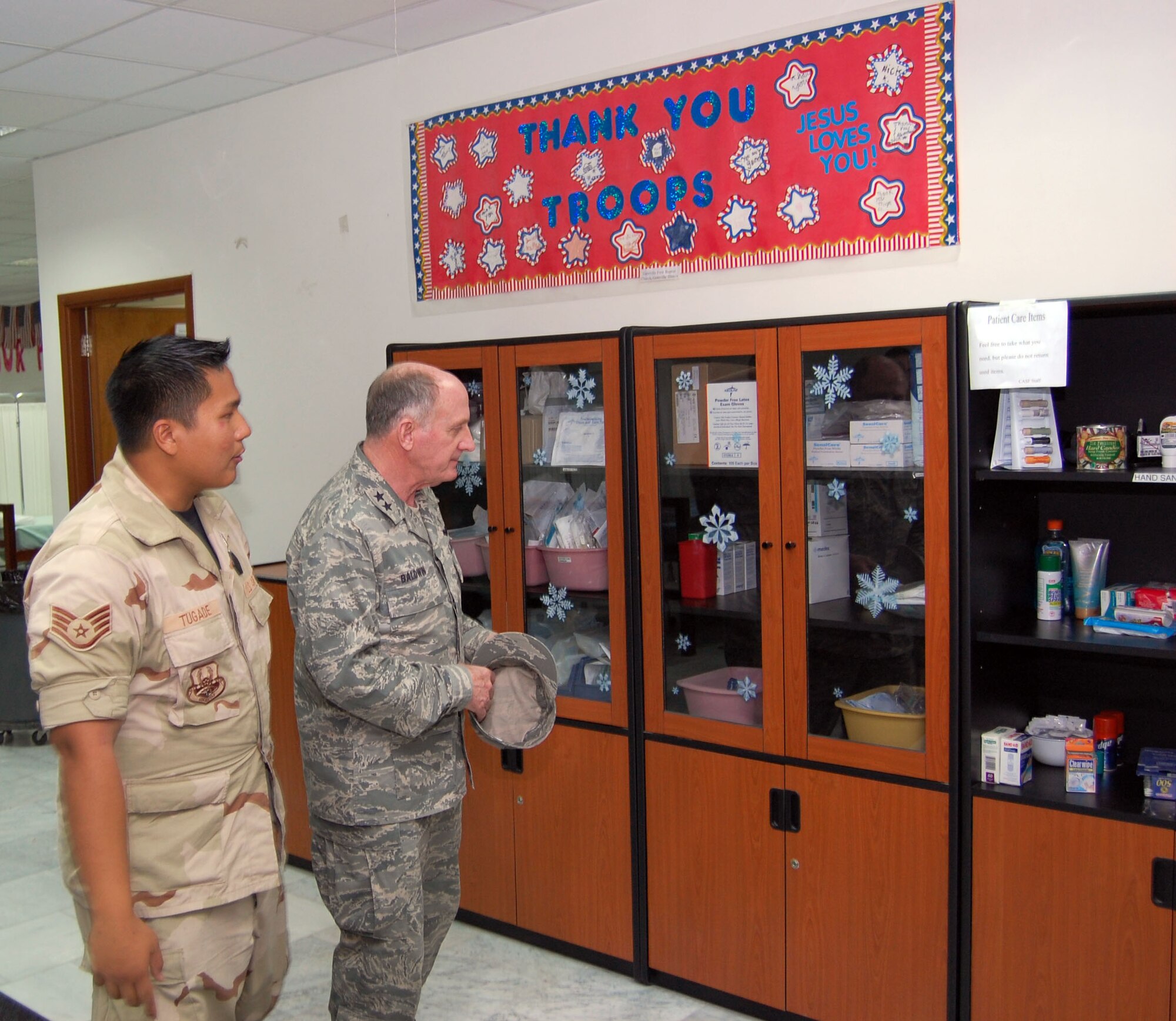 SOUTHWEST ASIA – Staff Sgt. Jason Tugade gives a tour of the contingency aeromedical staging facility to Maj. Gen. Charles Baldwin at an air base in the Middle East Dec. 6. Sergeant Tugade is assigned to the 386th Expeditionary Medical Group as a medical technician and is from Hickam Air Force Base, Hawaii. Chaplain Baldwin is the Air Force’s chief of chaplains. (Air Force photo\ Staff Sgt. Phillip Butterfield) 
 
