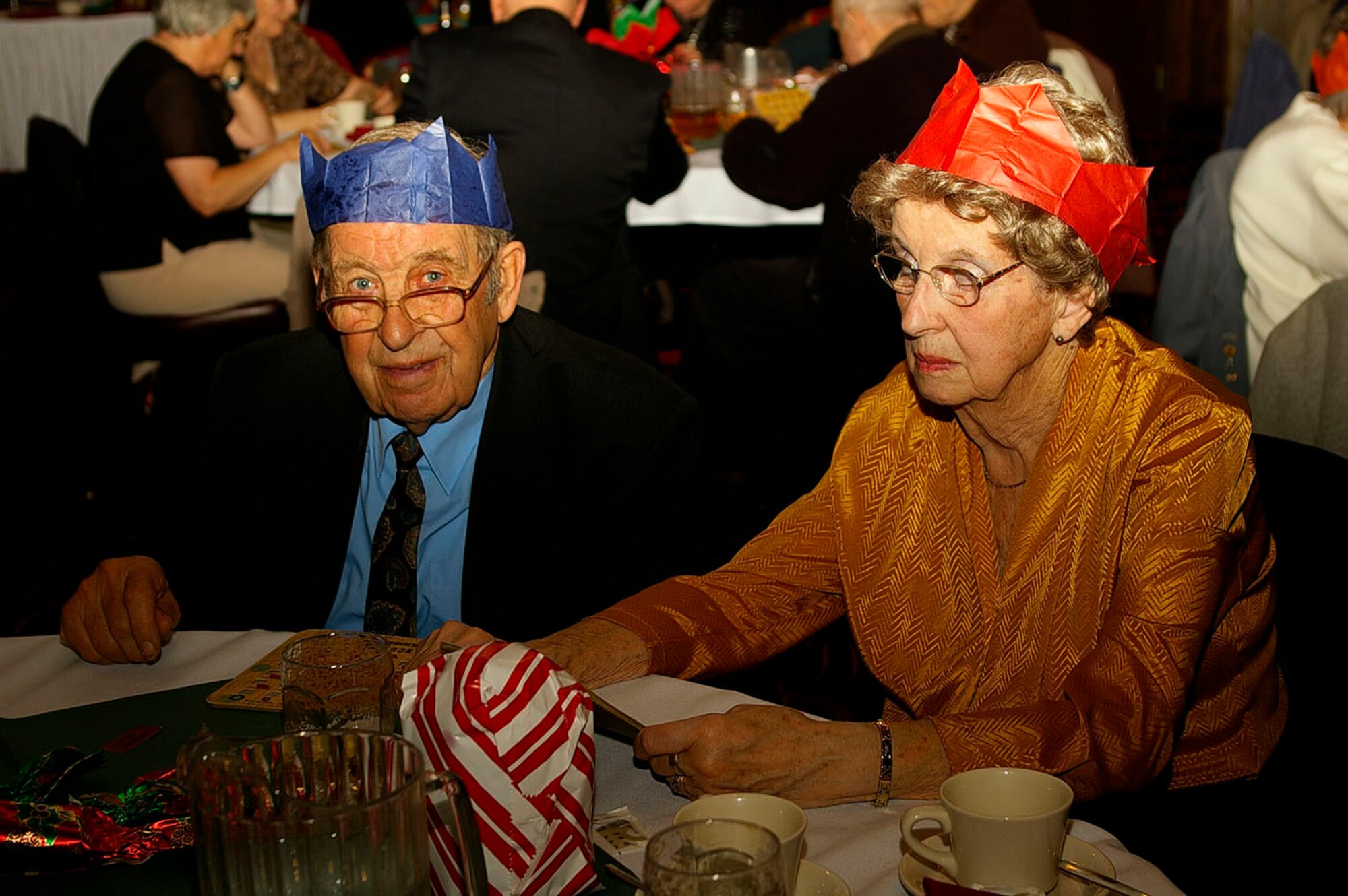 Ben and Joan Aves, from West Row, play Bingo at the senior citizens' luncheon at the Galaxy Club Dec. 5. The luncheon was hosted by the RAF Mildenhall Top 3 Fellowship. This is the 26th year they have hosted it with support from the rest of the base and local community. The local senior citizens are from the West Row Friendship club, Beck Row Thursday Club, Beck Row Chapel and Mildenhall Royal British Legion. Other participants were from senior citizen homes in the local area. (U.S. Air Force photo by Karen Abeyasekere)