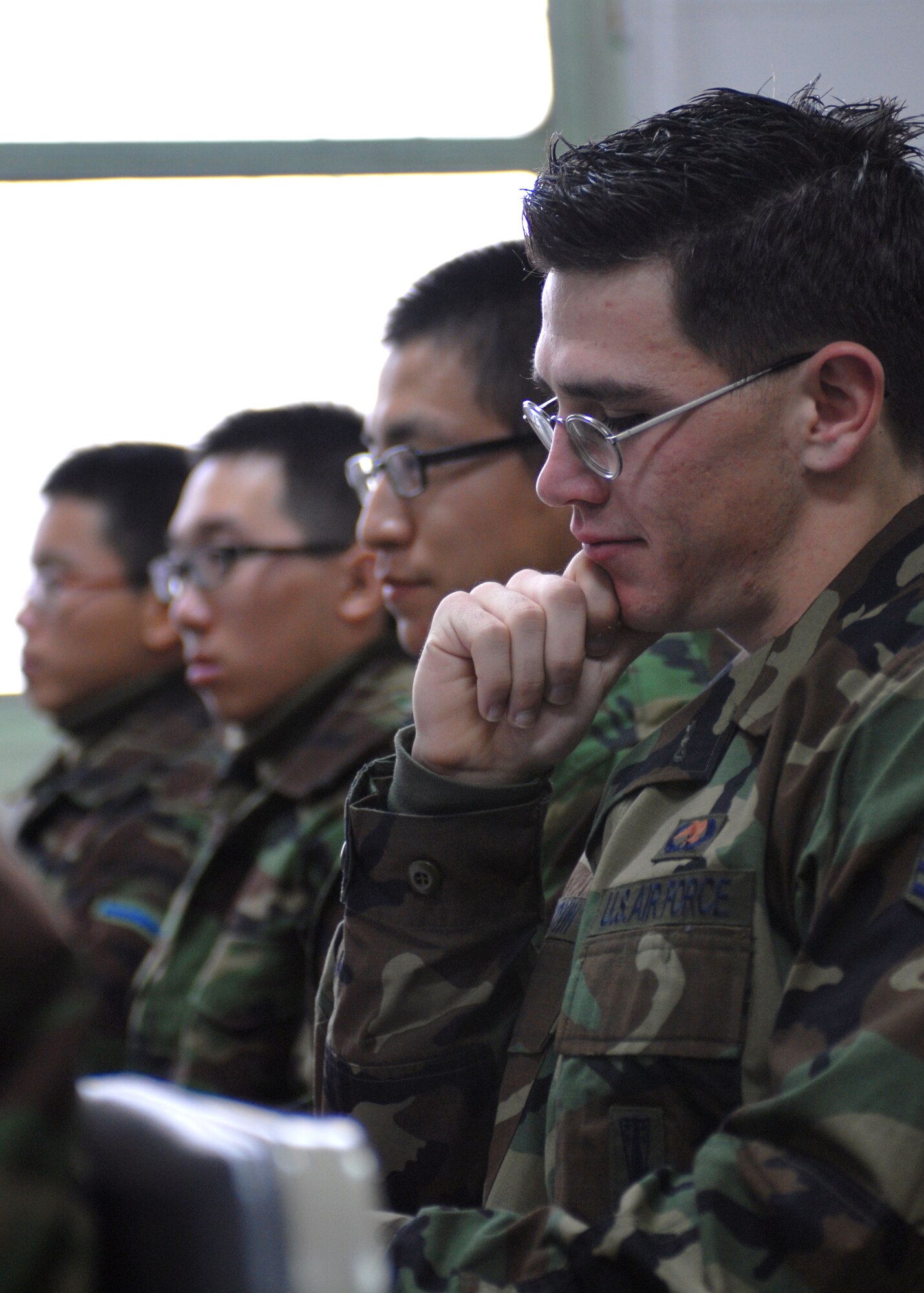 CHUNG JU AIR BASE, South Korea—Senior AirmanTyler Brown, 8th Maintenance Squadron weapons load crew member looks over a F-4 training guide Dec. 7 here. The training is a way for U.S and Republic of Korea Airmen to develop teamwork learn from each other to improve war fighting capabilities. (U.S. Air Force Photo/Staff Sgt Araceli Alarcon) 